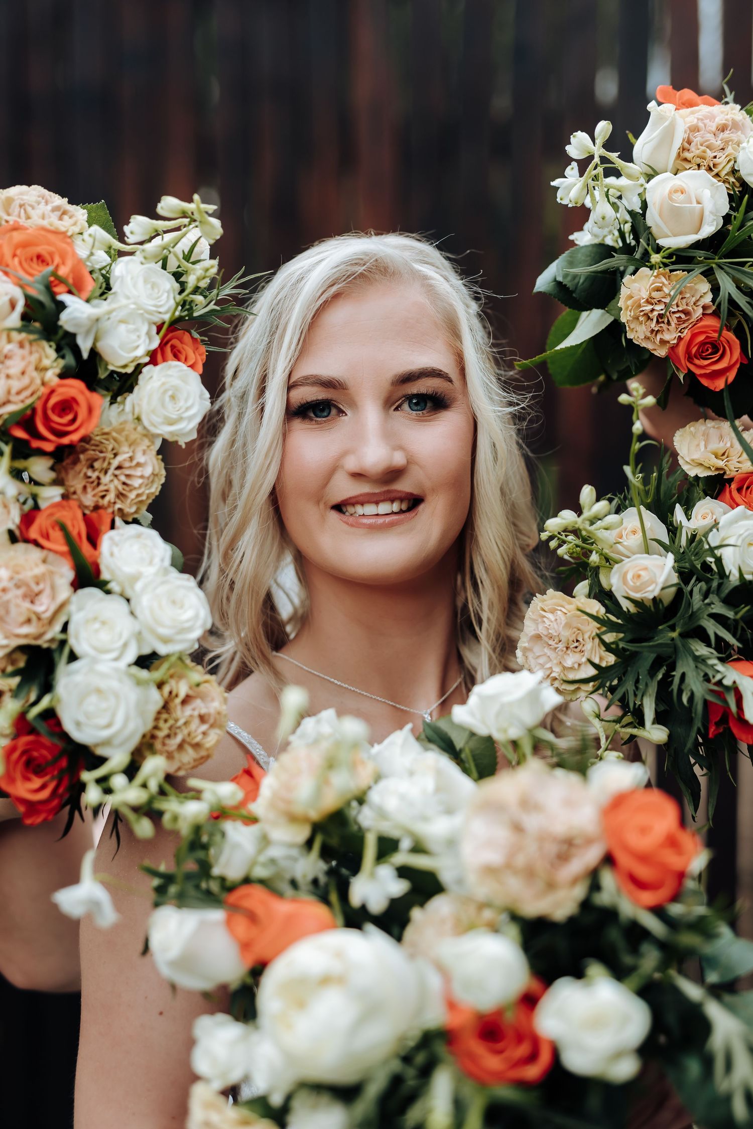 Wedding bouquets featuring orange and white roses with greenery arranged in a collage of four similar floral photos.