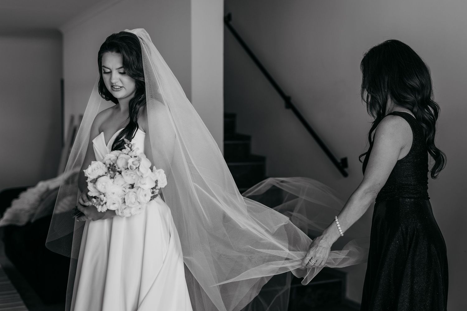 A black and white collage of wedding moments showing bridal preparations, dress details, and veil arrangements.