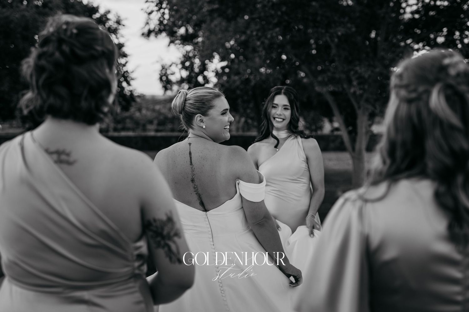 Black and white wedding ceremony photos show intimate moments between guests and couple during outdoor celebration.