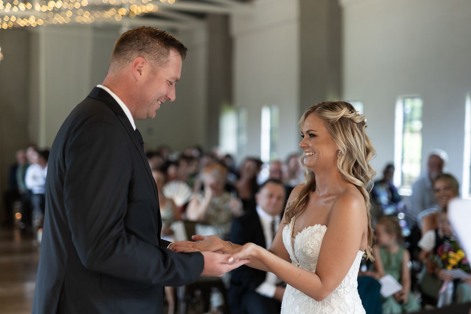 A couple exchanges rings during their wedding ceremony.