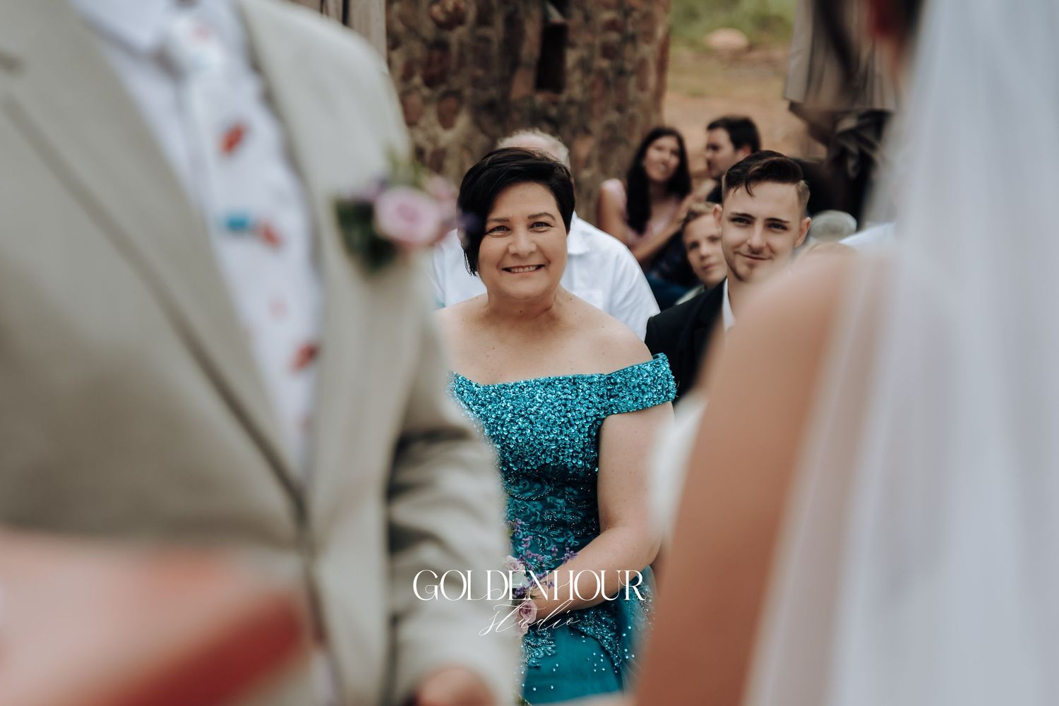 Candid wedding celebration moment captured during an outdoor ceremony.