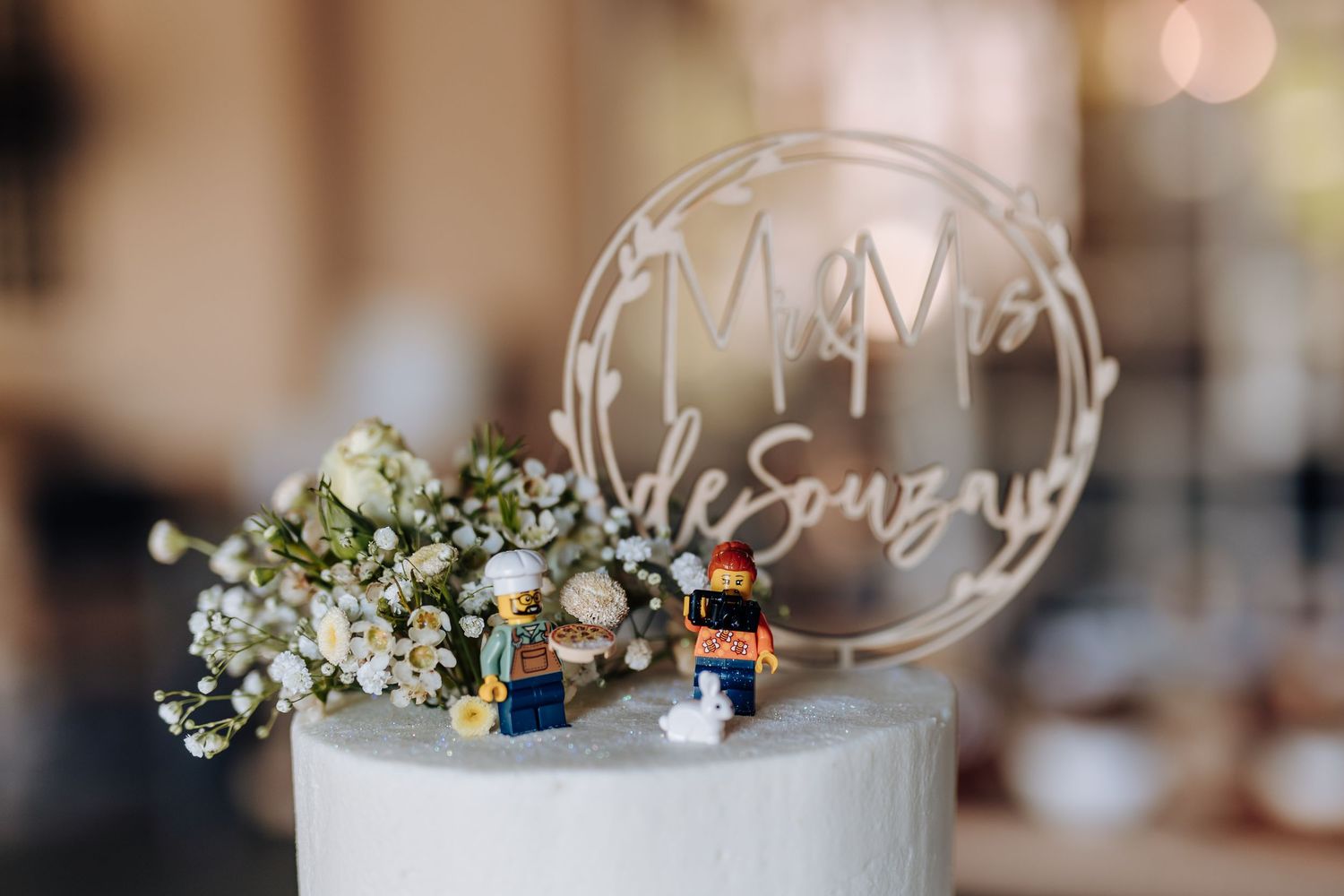 Wedding reception table settings with delicate floral centerpieces and glowing candlelight create an elegant atmosphere.