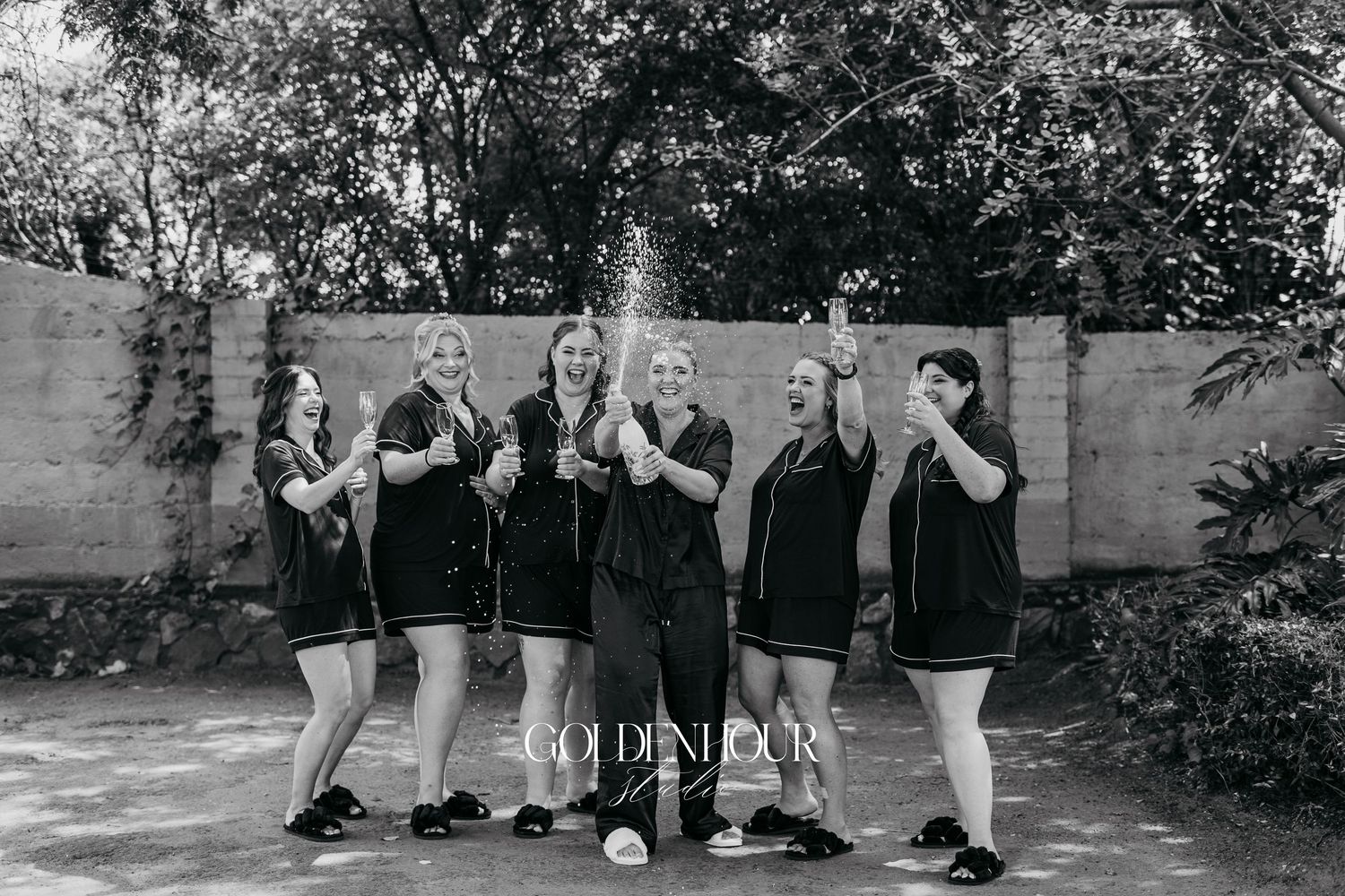 A series of black and white photographs showing people posing against a wall in various group formations.