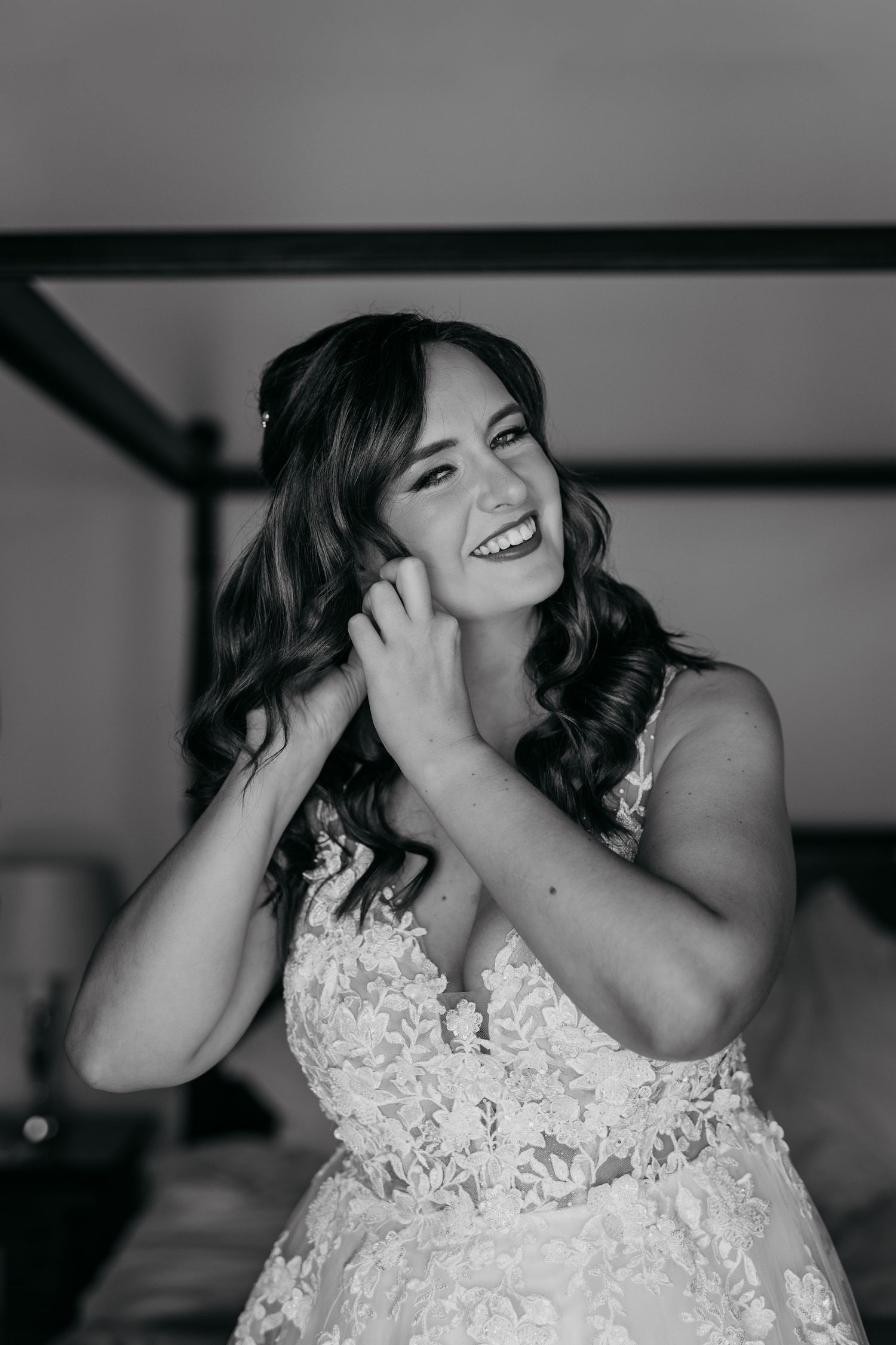 A black and white photo series shows a bride in a lace wedding dress laughing joyfully during a candid moment.