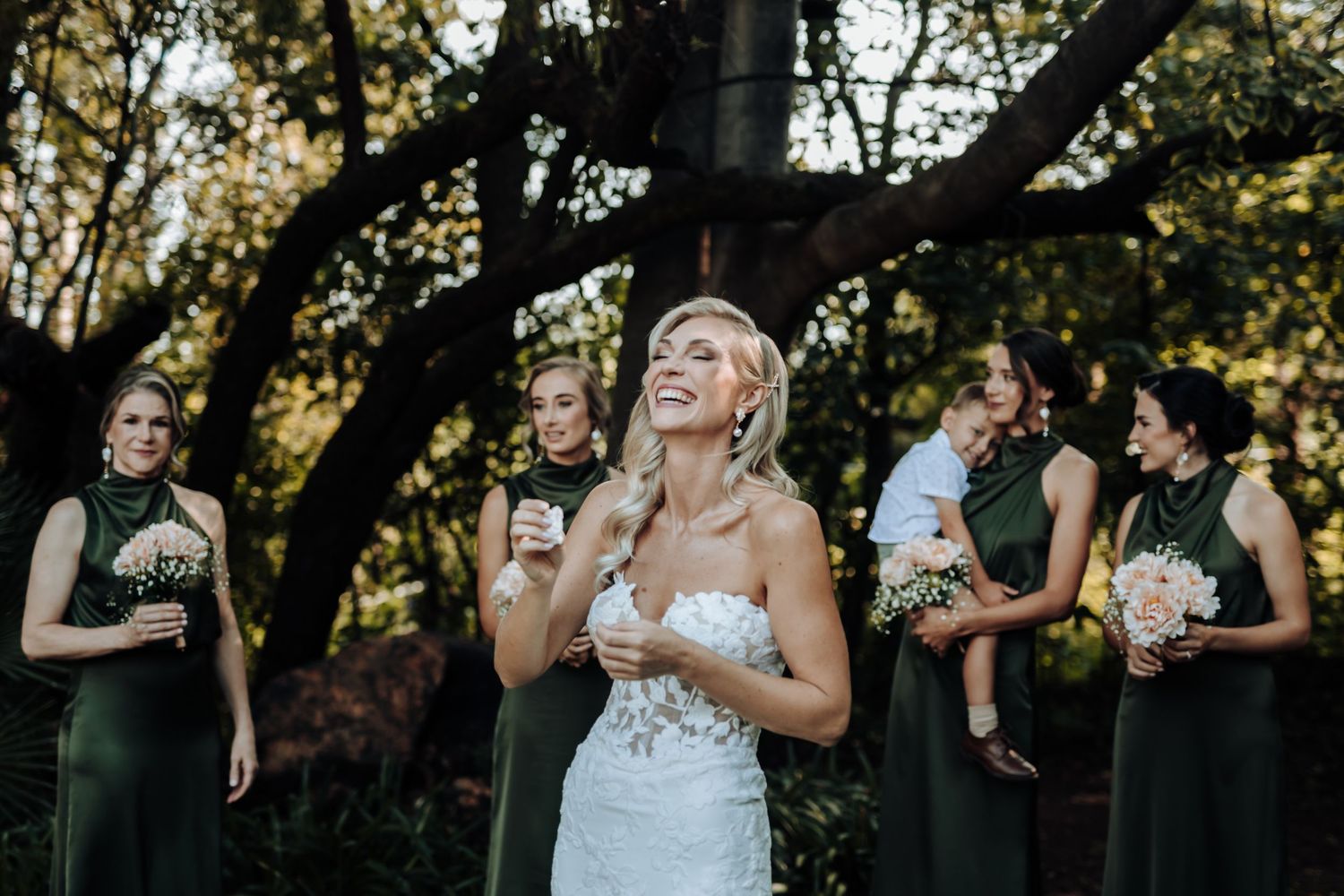 A lively party scene with guests dancing and socializing outdoors during a wedding celebration.