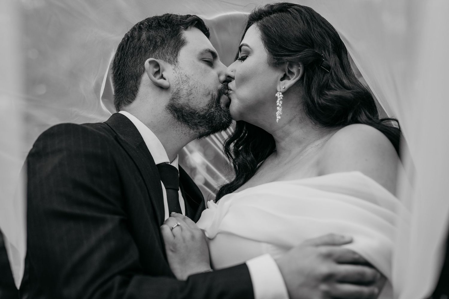 Romantic black and white close-up portraits of tender wedding moments.