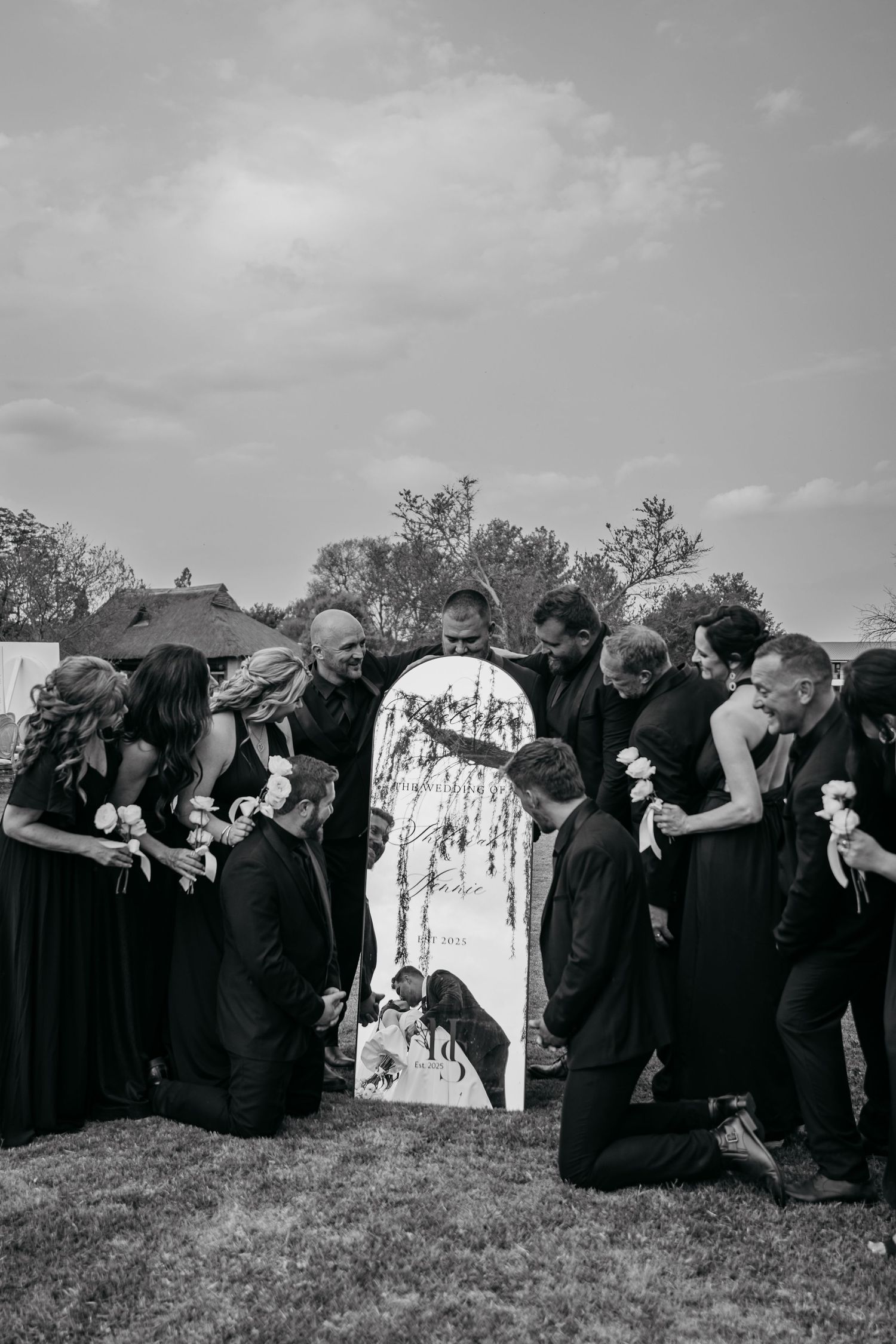 A black and white photo sequence shows a group of people in dark robes performing a synchronized bowing motion outdoors.