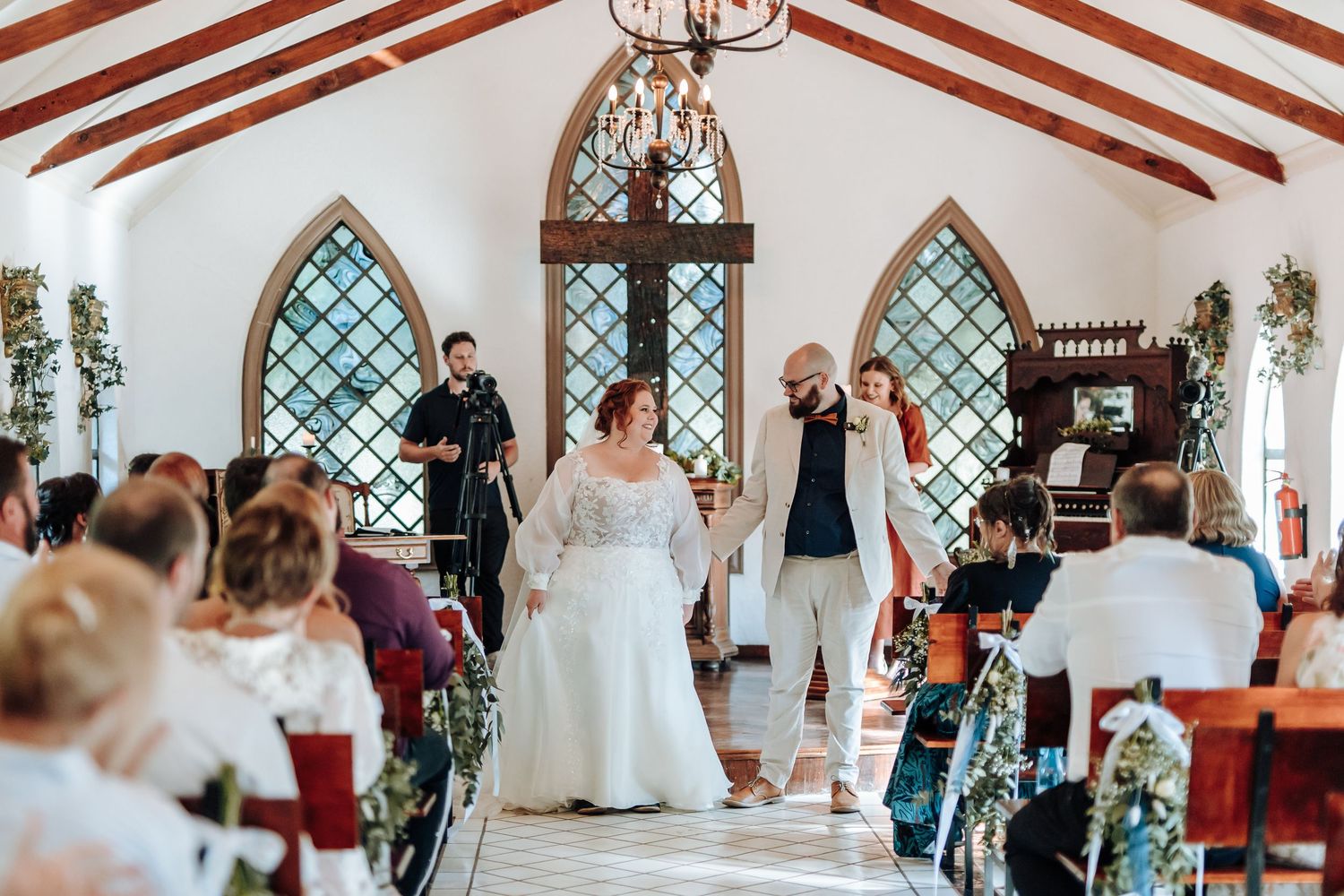 A collage of wedding ceremony moments inside a bright church venue with decorative arched windows and elegant decor.