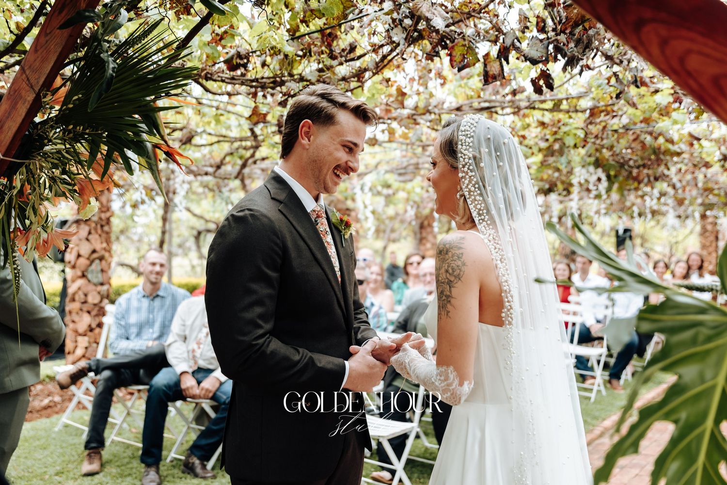 Candid outdoor wedding ceremony moments captured in a garden setting with natural lighting.