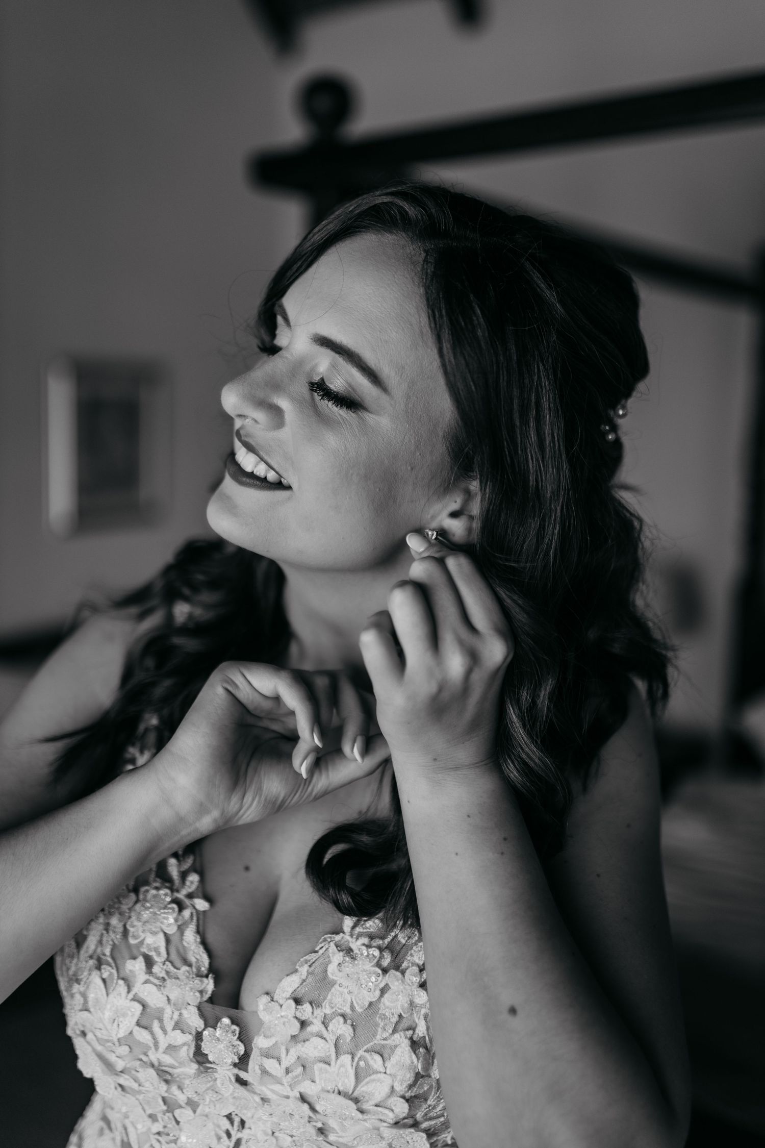 A bride in a lace wedding dress poses elegantly in black and white photographs showing different angles and expressions.