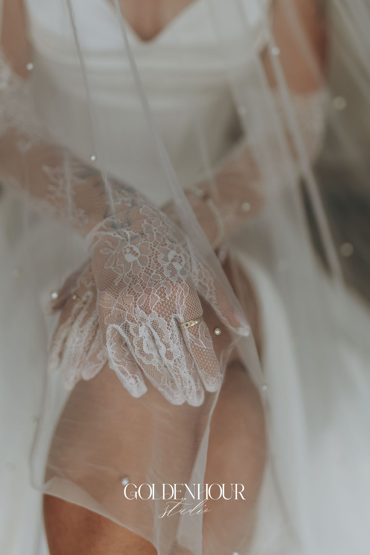 Delicate white lace details on sheer fabric create an elegant bridal design with Golden Hour text overlay.