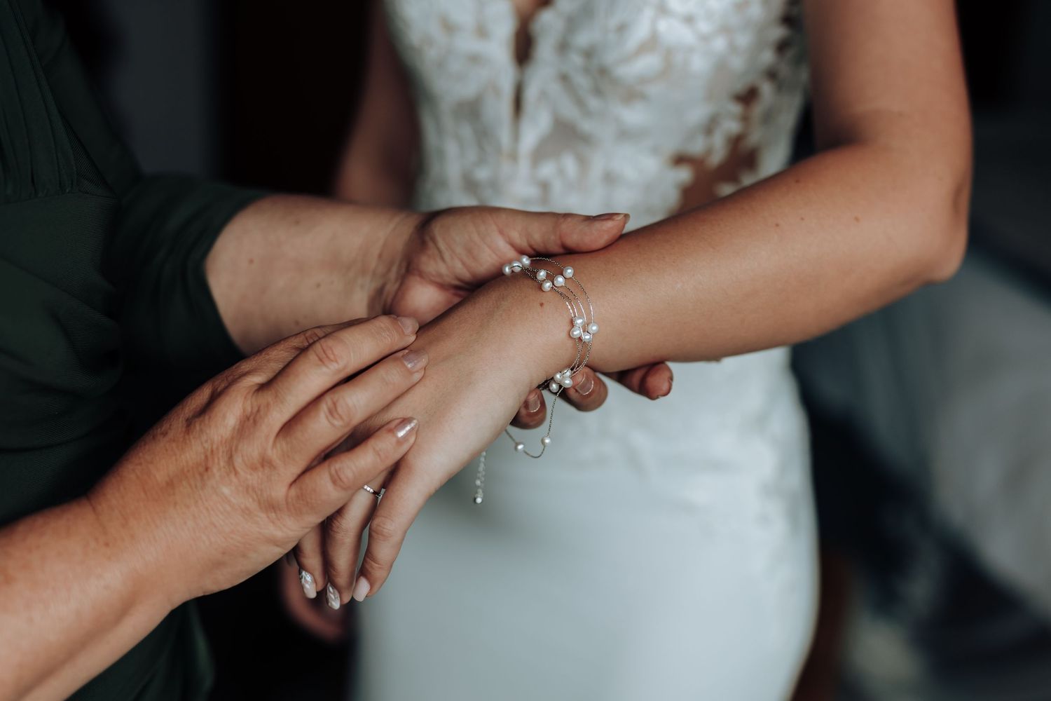 Close-up sequence showing hands exchanging rings during a wedding ceremony with sparkly jewelry details.