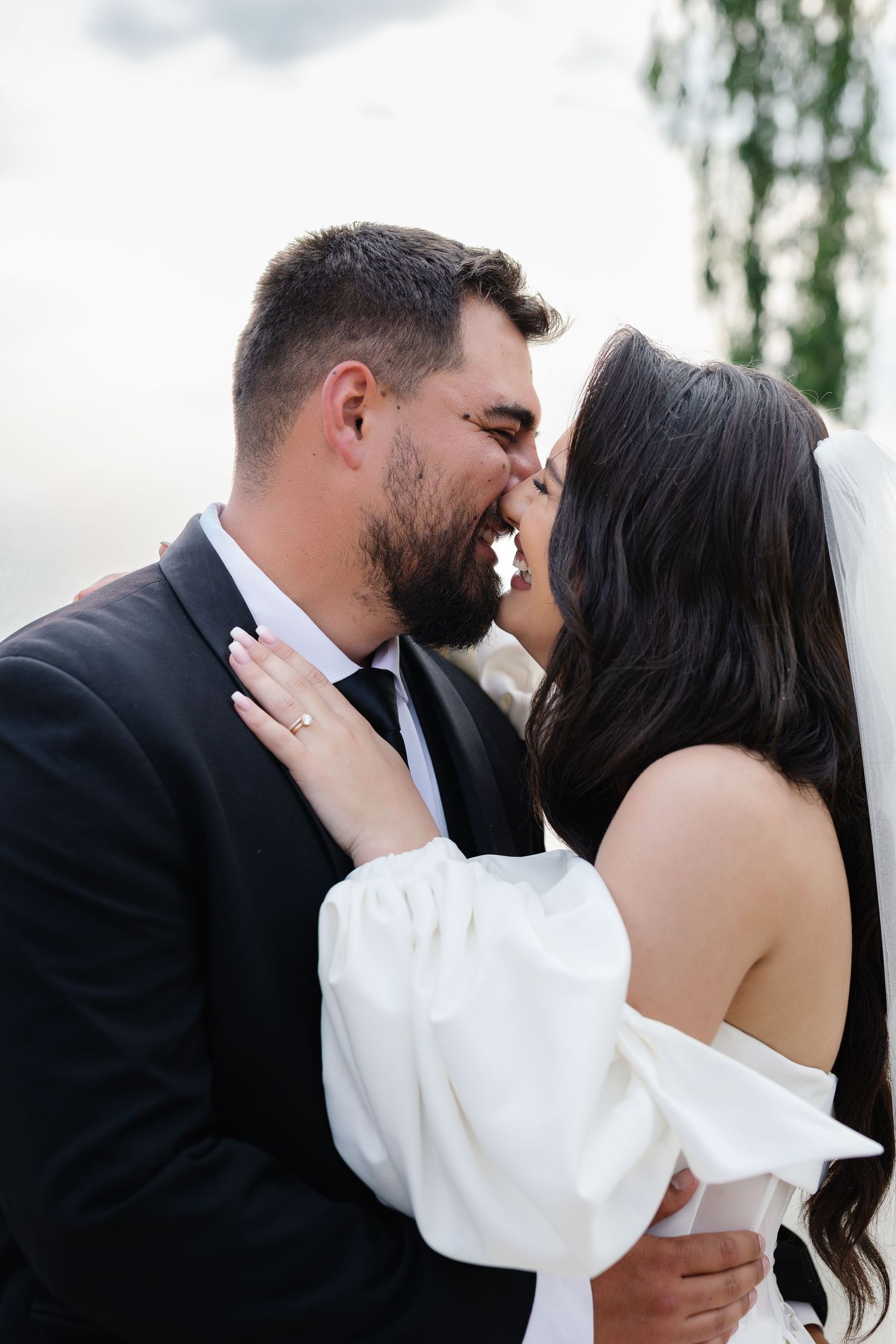 A romantic sequence of wedding photos showing a couple sharing intimate kisses against a soft outdoor background.