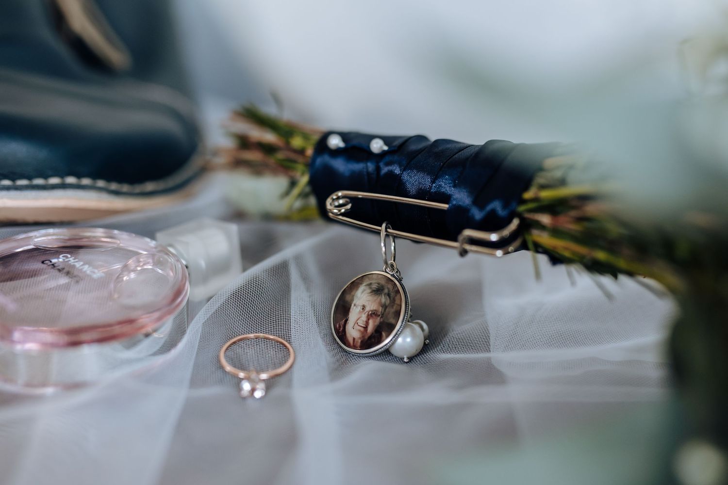 Wedding rings and engagement ring details on a soft blurred background with bokeh lighting effects.