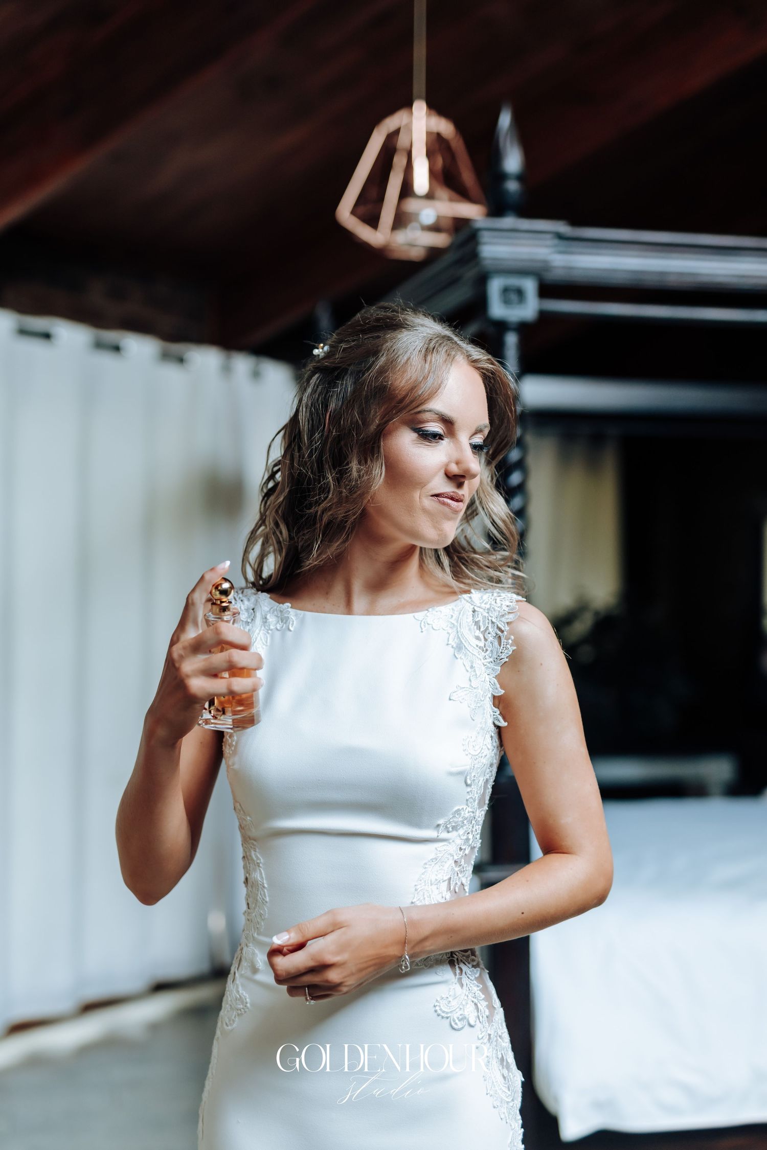 An elegant wedding dress with delicate lace details and a fitted silhouette creates a romantic bridal moment.
