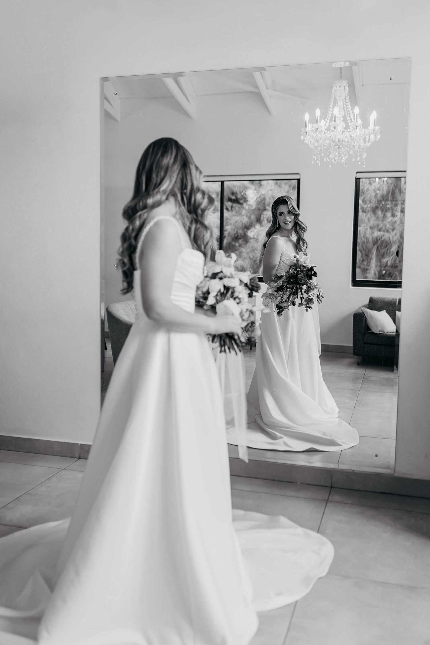 A black and white photo series showing the flowing movement of a white wedding dress during a dance.