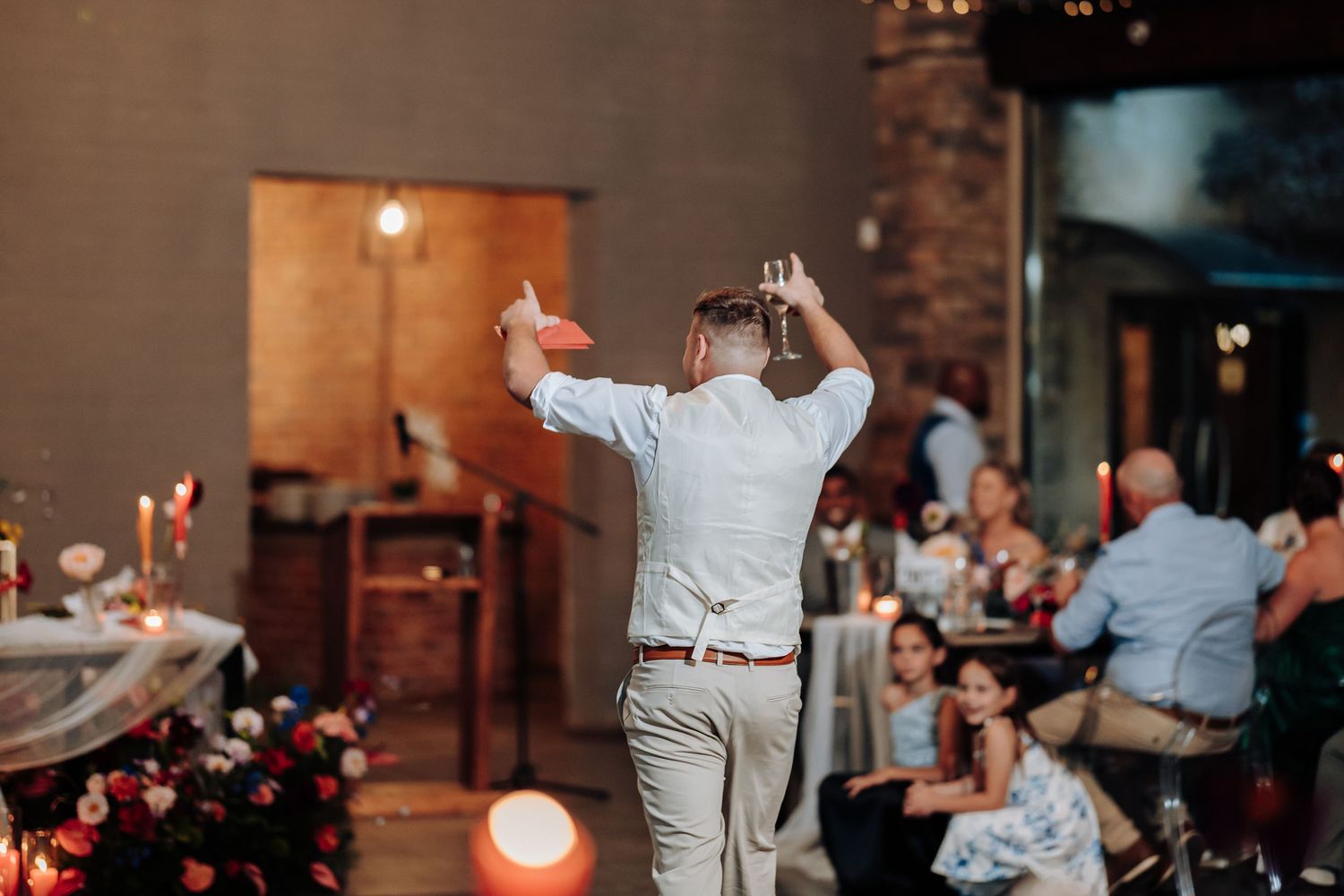 Wedding guests enjoying the celebration with dancing and entertainment.
