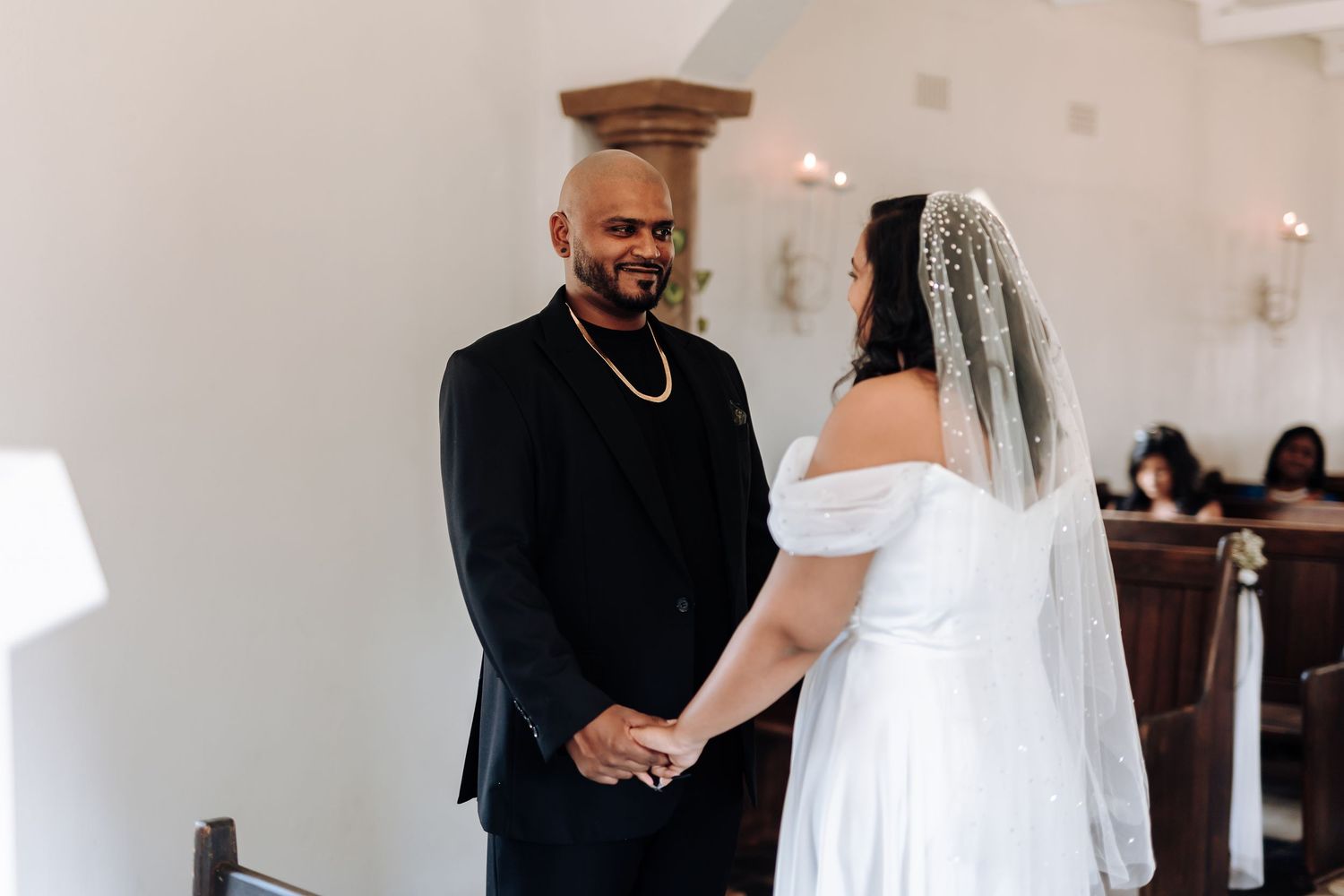 An intimate moment between the bride and groom during their wedding ceremony.