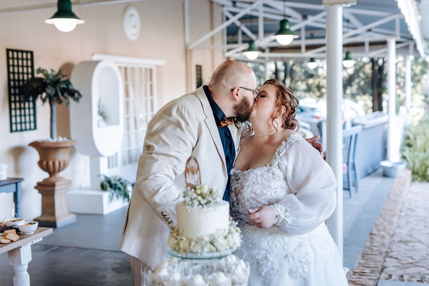 A series of romantic wedding moments showing cake cutting, dancing, and kissing along a covered porch.