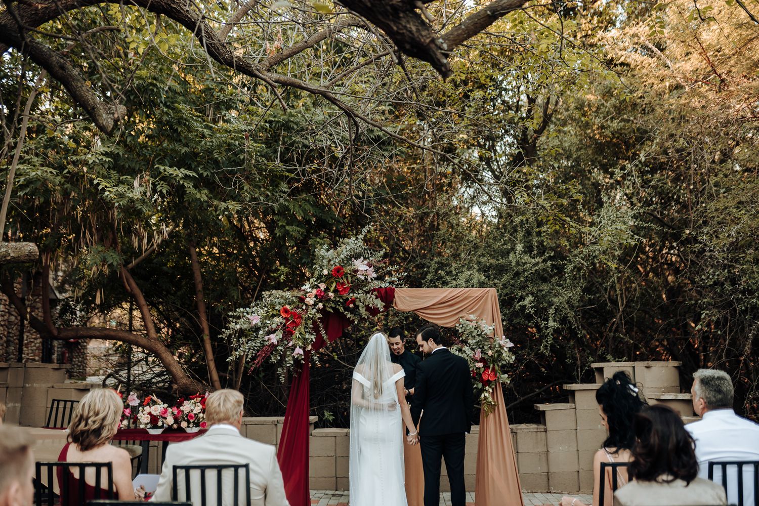 A joyful moment during an outdoor wedding ceremony.