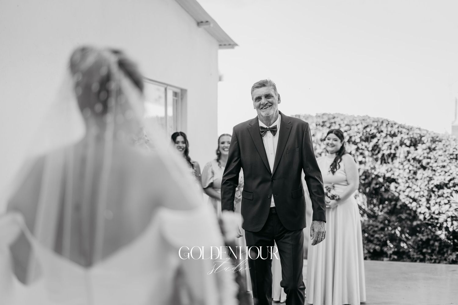 A series of candid wedding moments showing a bride and wedding party walking through an outdoor venue.