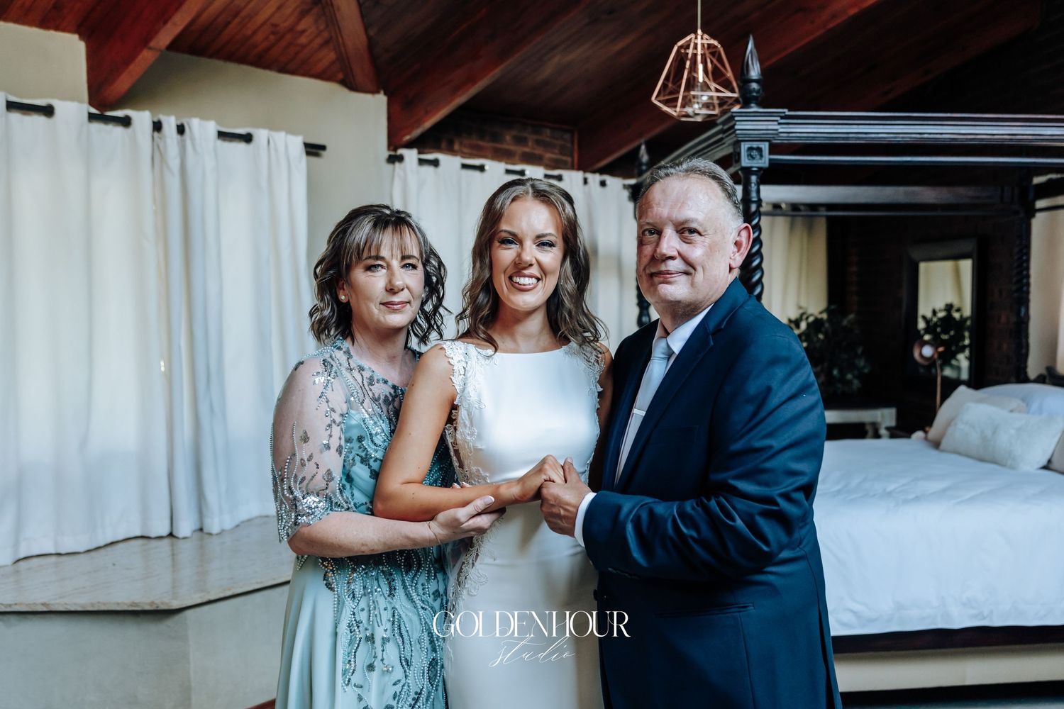 A heartwarming moment captured between family members at an indoor wedding celebration.