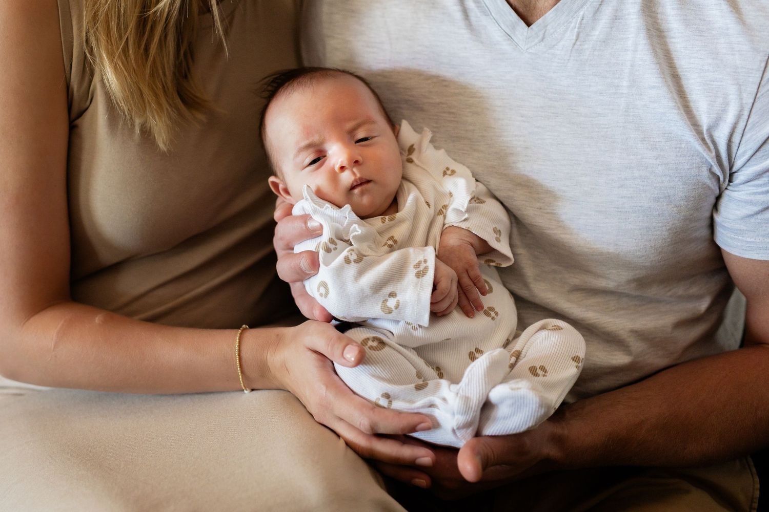 Series of lifestyle photographs showing tender family moments while resting together.