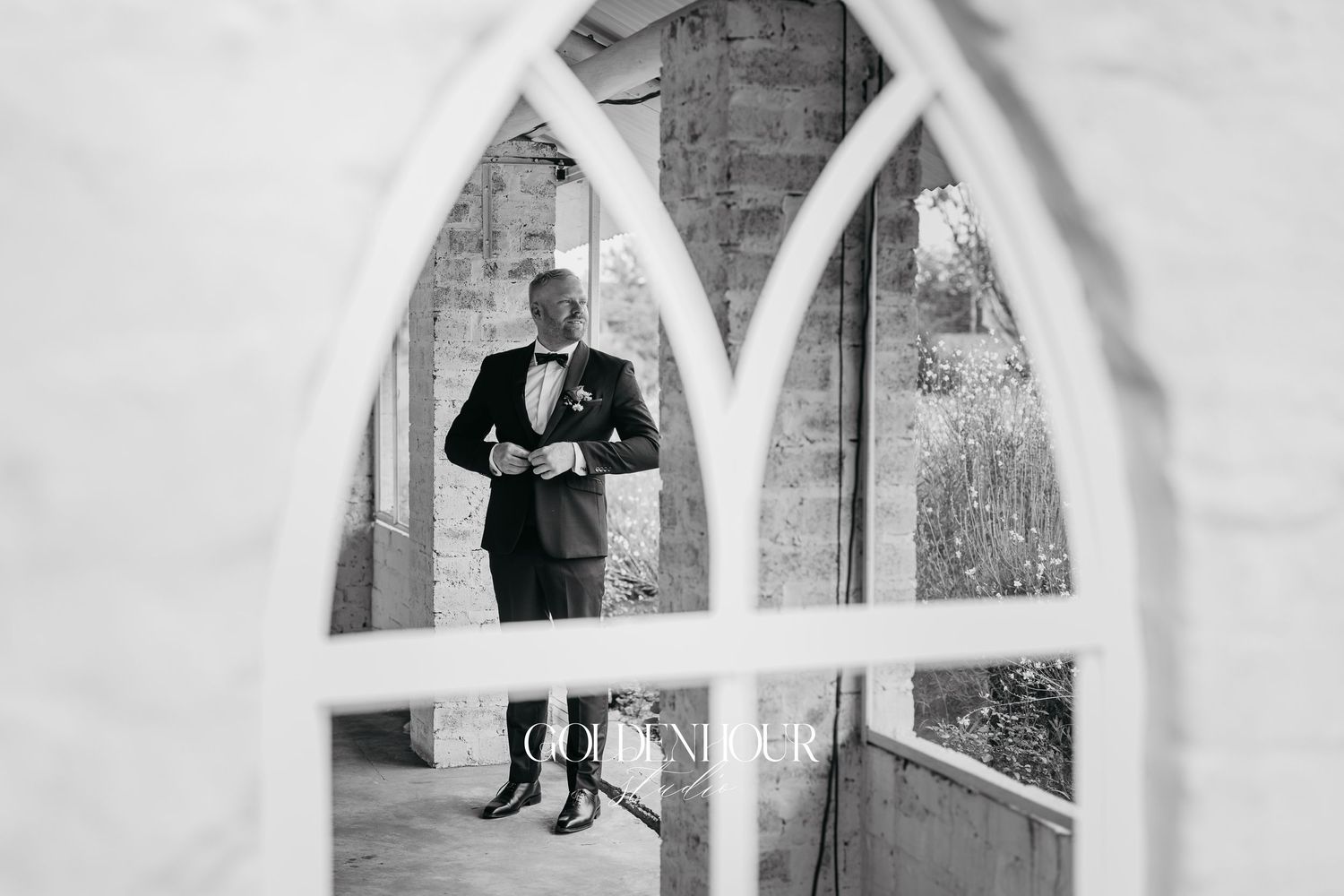 A series of black and white wedding photos displayed in arched window frames shows romantic moments between newlyweds.