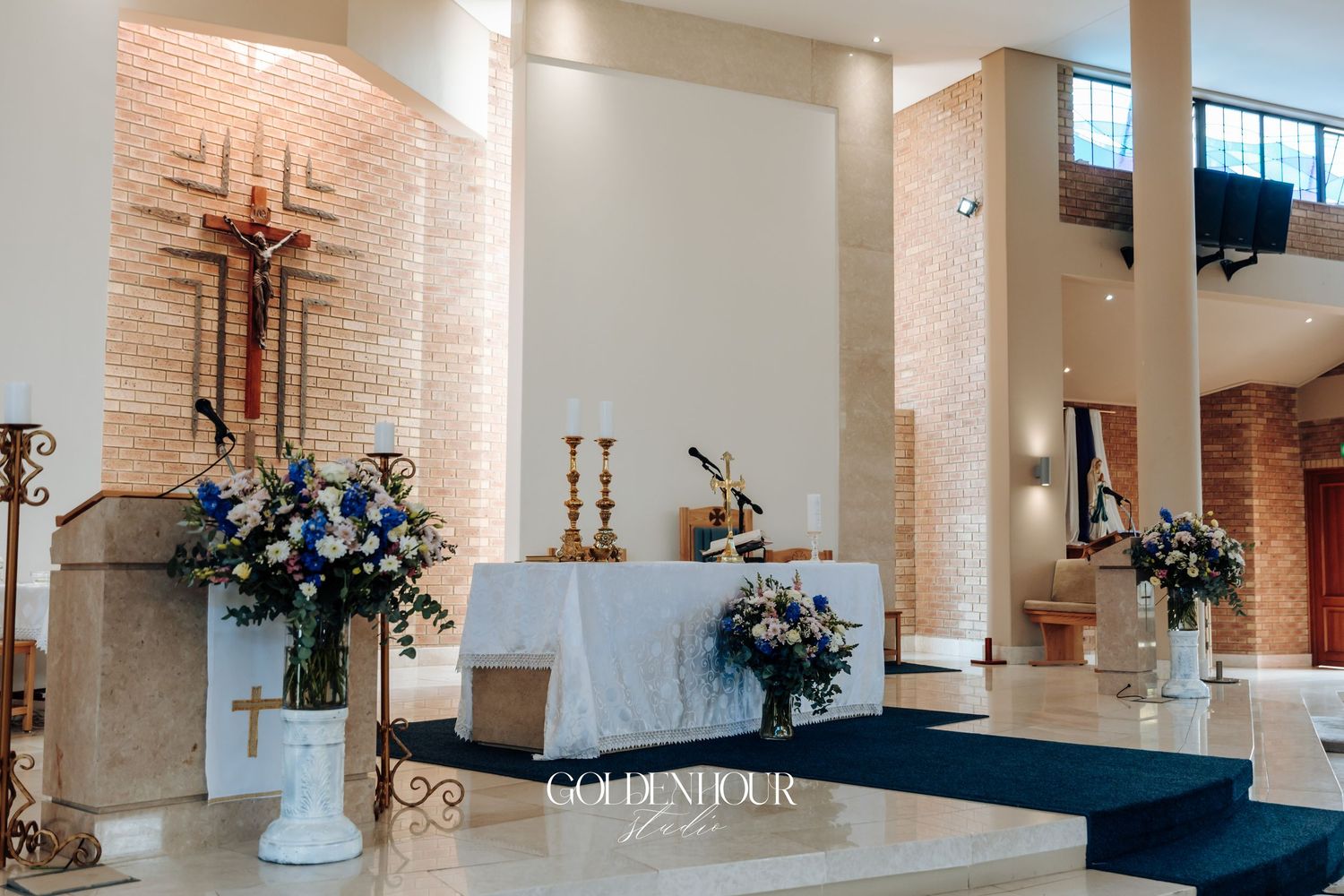 Modern church interior with high ceilings, white columns and natural lighting.