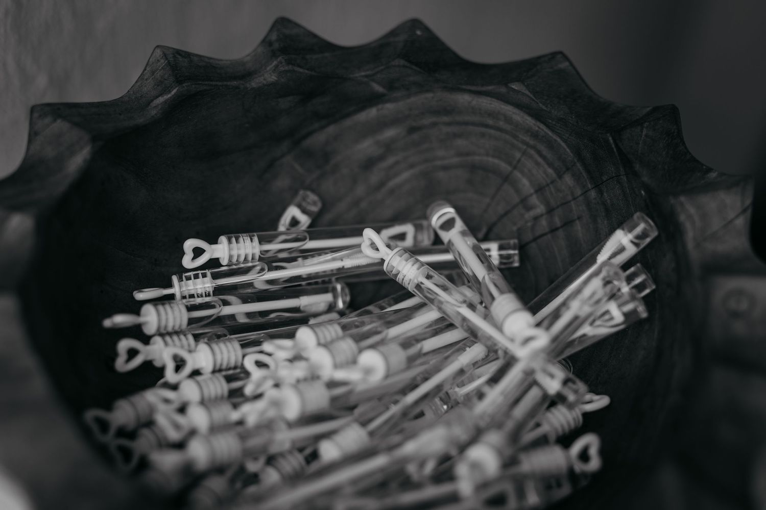 Black and white detail shot of decorative metal keys arranged in circular pattern.