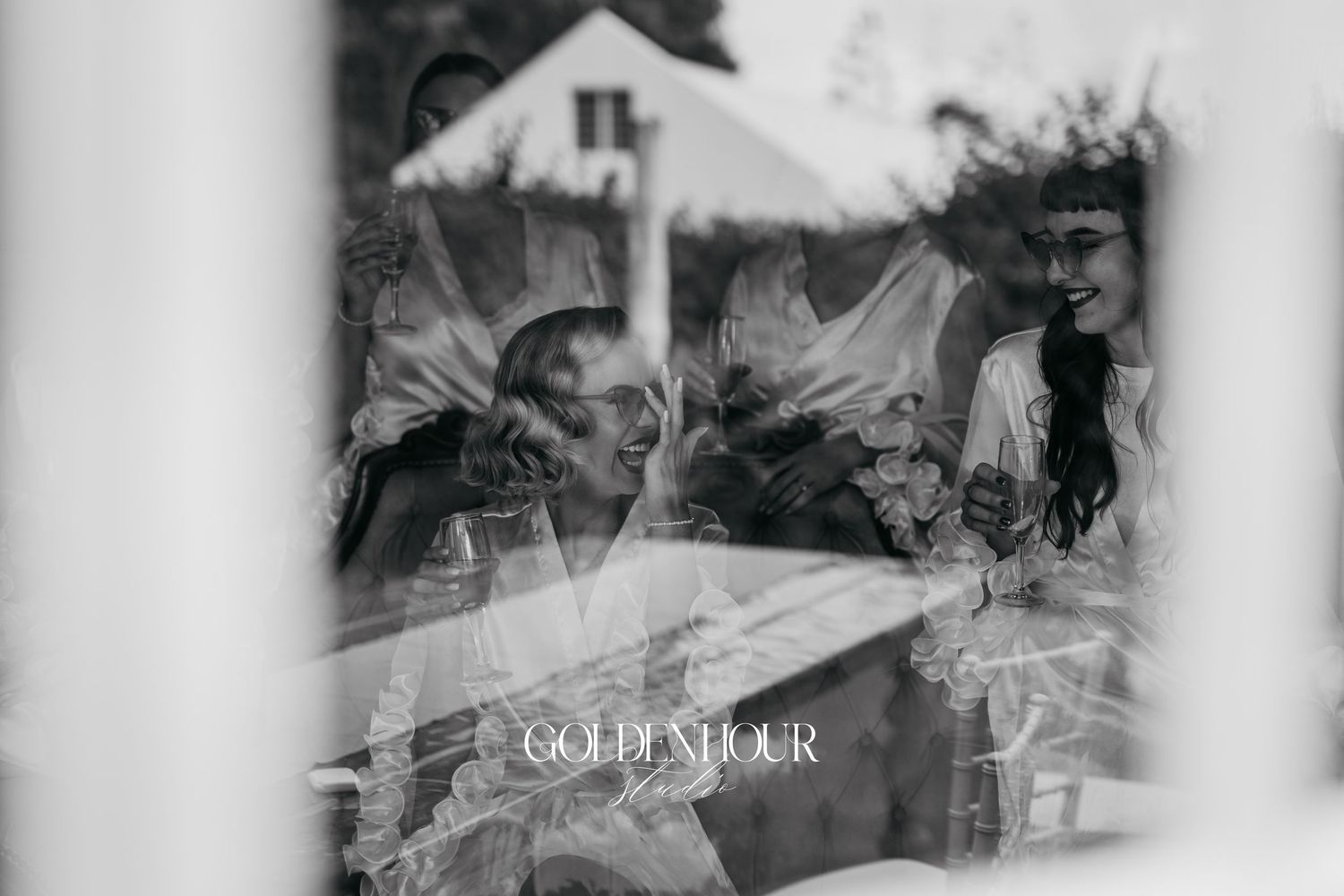 Black and white artistic shot of wedding party preparations.