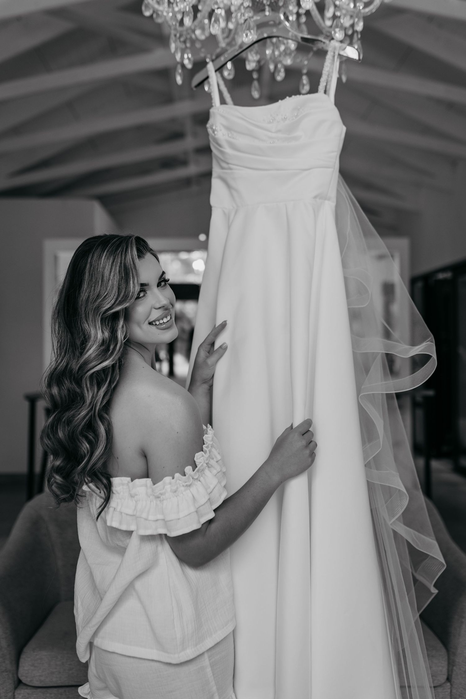 Black and white photos show close-up details of a wedding dress and veil.