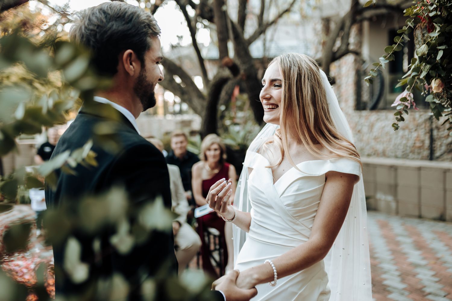A candid moment during the wedding vow exchange.