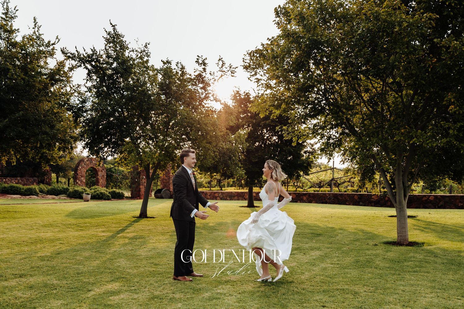 Sunset wedding photography session in a scenic park setting.