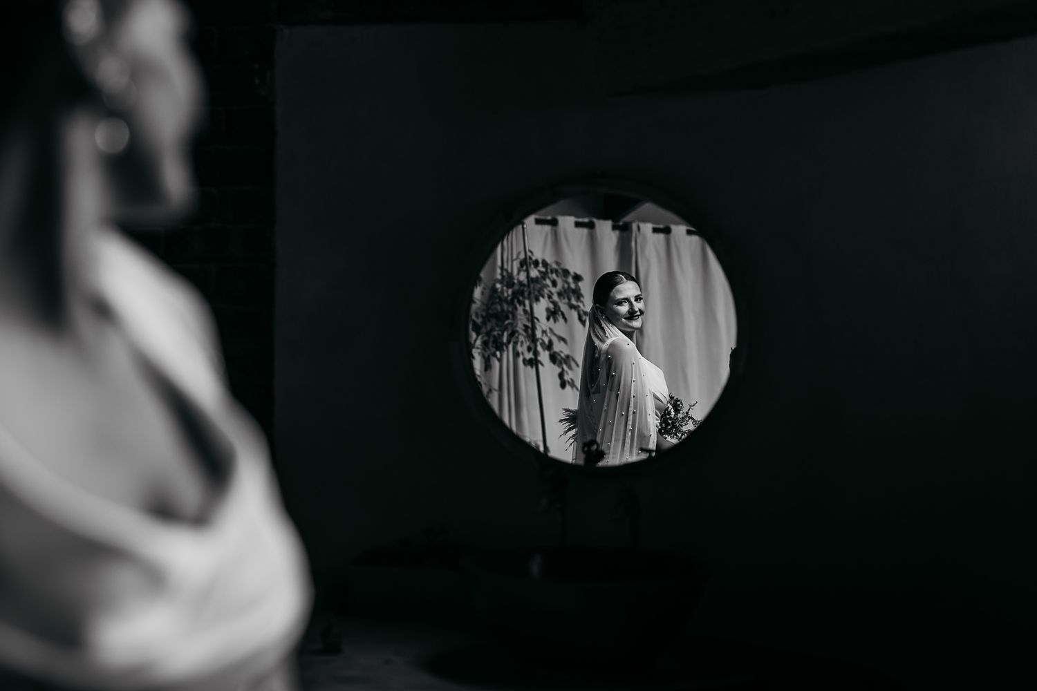 A series of black and white vintage photographs arranged in a horizontal filmstrip-like layout showing wedding moments.