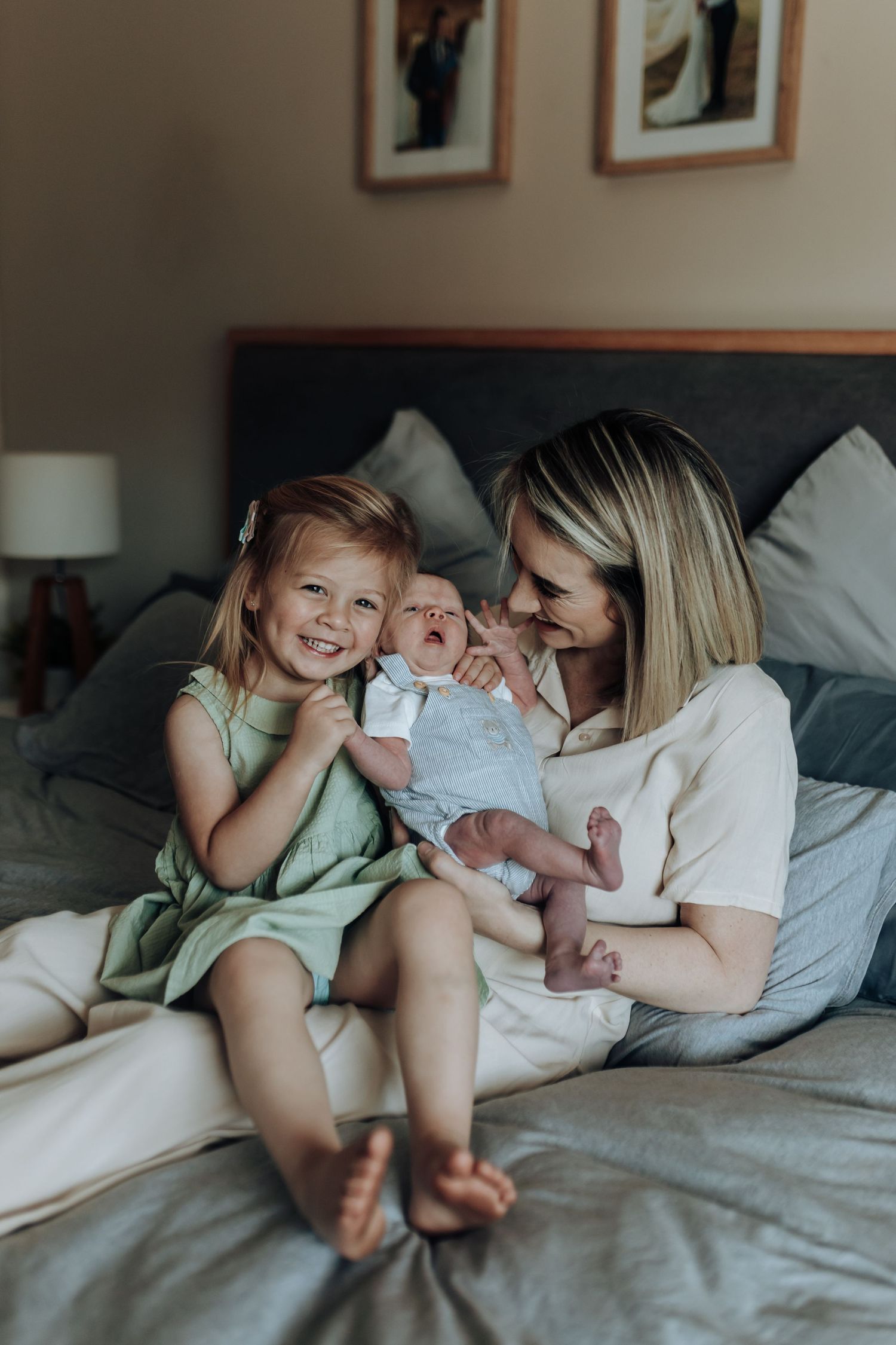 A candid lifestyle series captures joyful interactions between family members relaxing on a cozy bed.