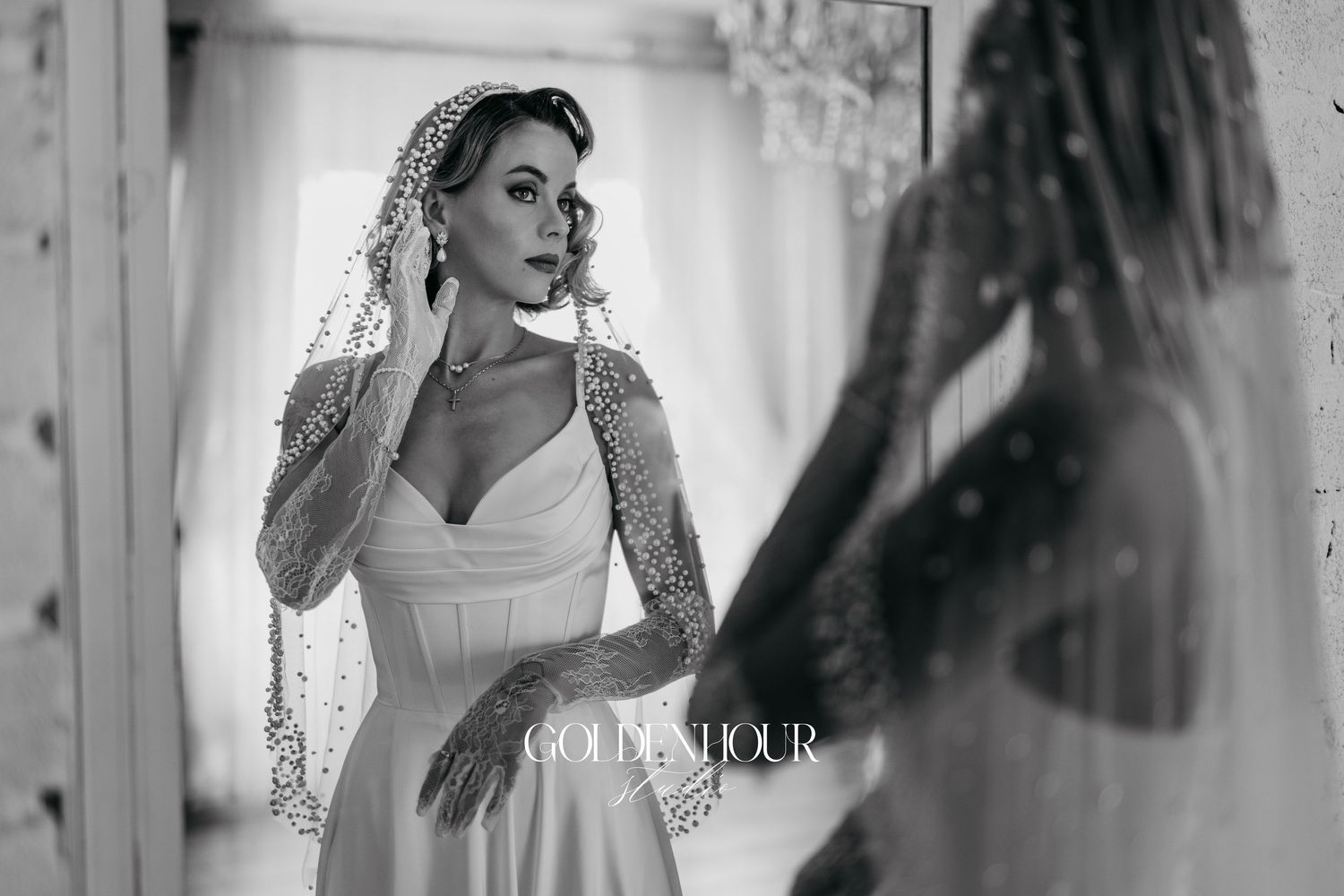 Black and white candid wedding preparation moments with flowing veil and lace details.