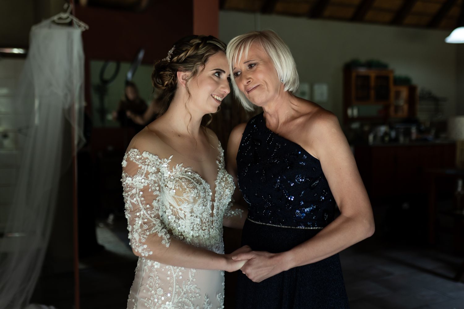 A heartwarming moment shared between two people during wedding preparations.