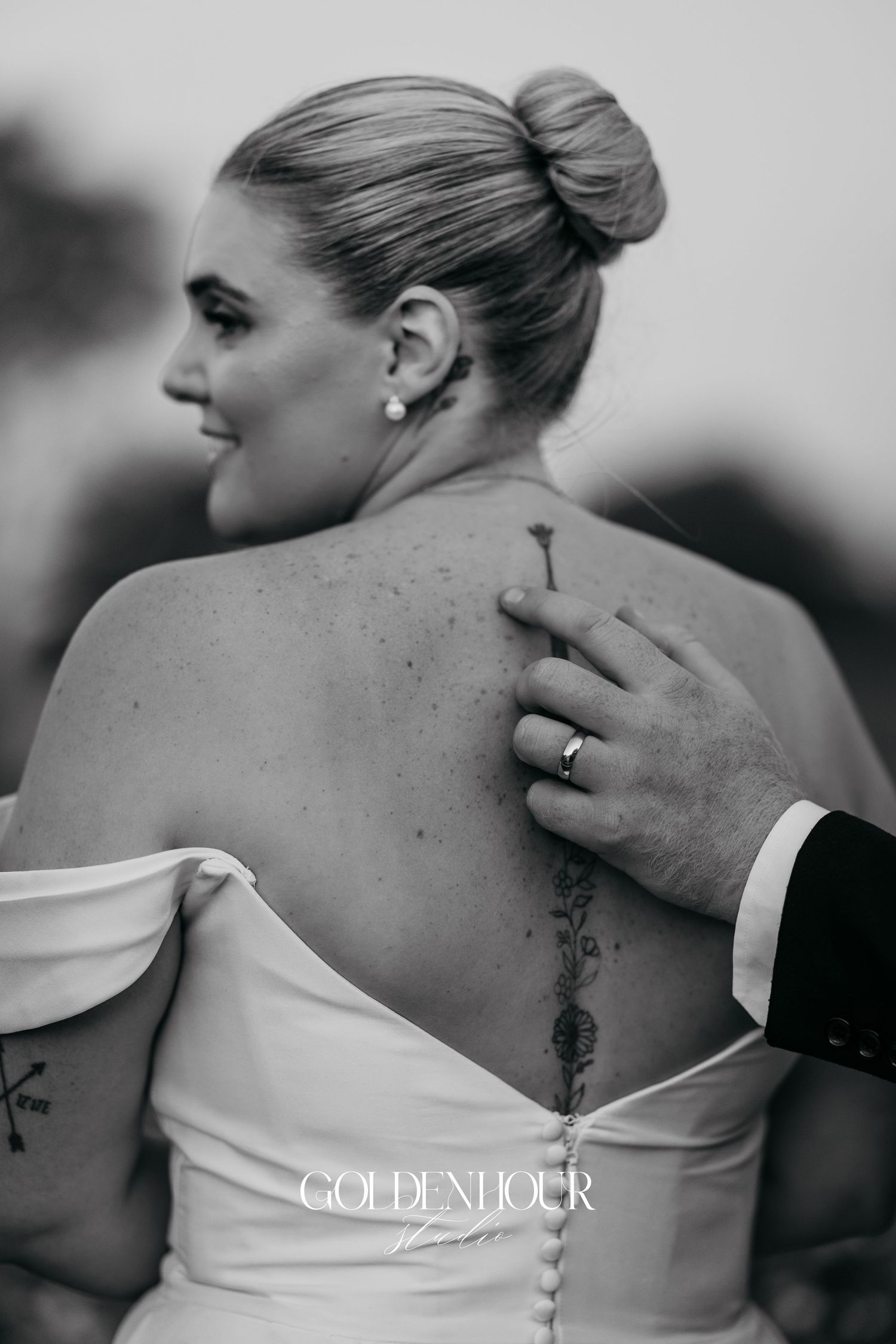 Black and white photo series showing close-up details of a bride's back in a strapless wedding dress.