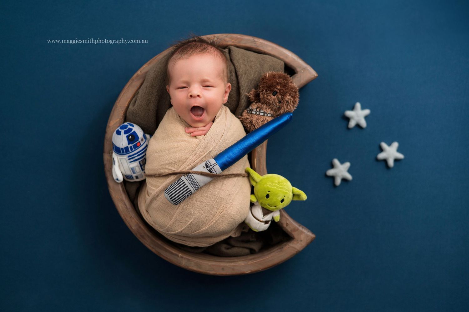 A collage of images showing a baby yawning and resting in a cozy brown bassinet with a small plush toy. Star Wars newborn shoot