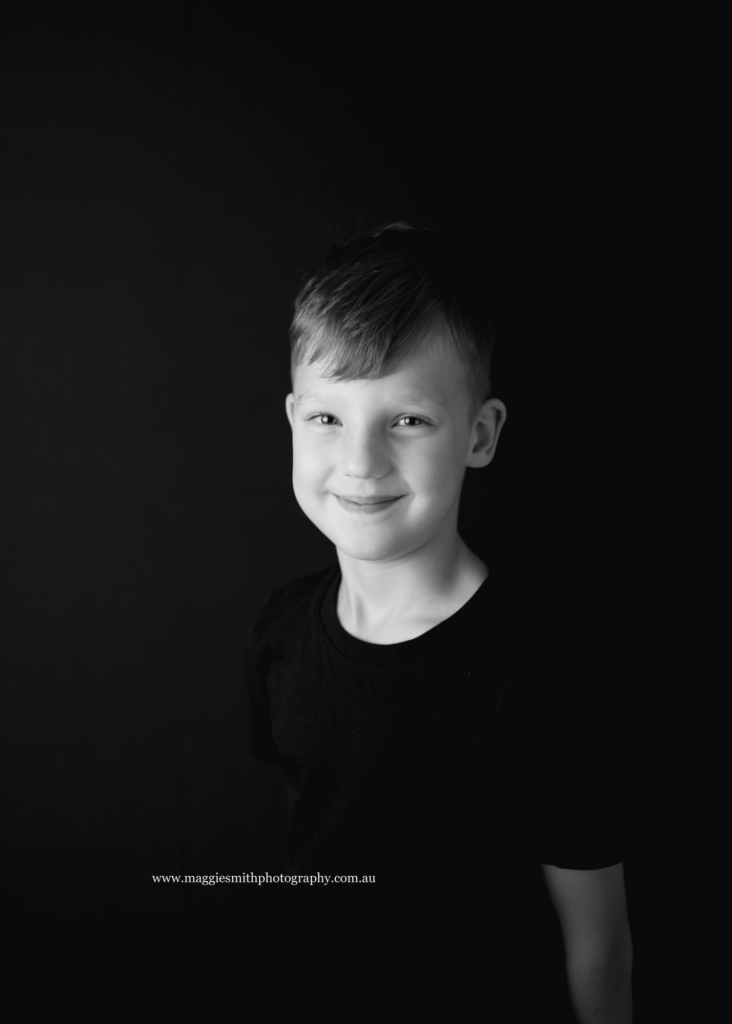 A dramatic black and white portrait series showing close-up views of a young person's face against a dark background. Child photography