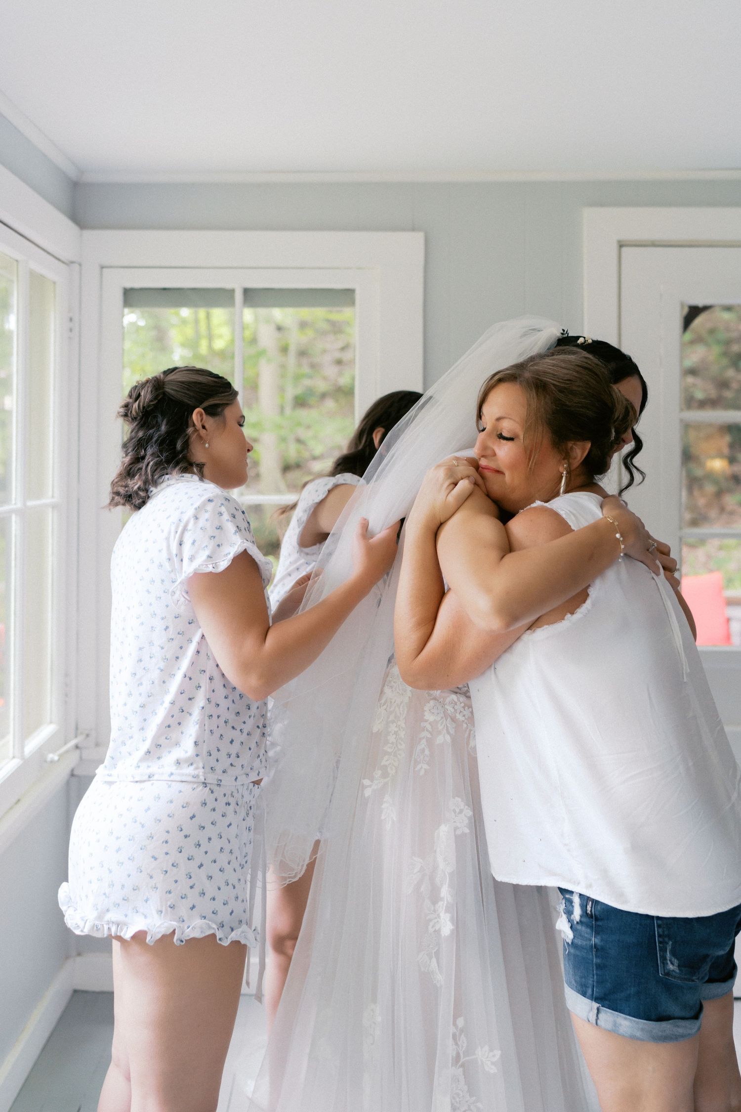 A sequence of five photos showing someone helping another person try on a white wedding veil in a bright room.
