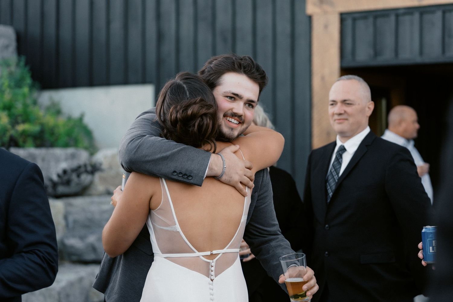 Wedding guests mingling during an outdoor cocktail reception.