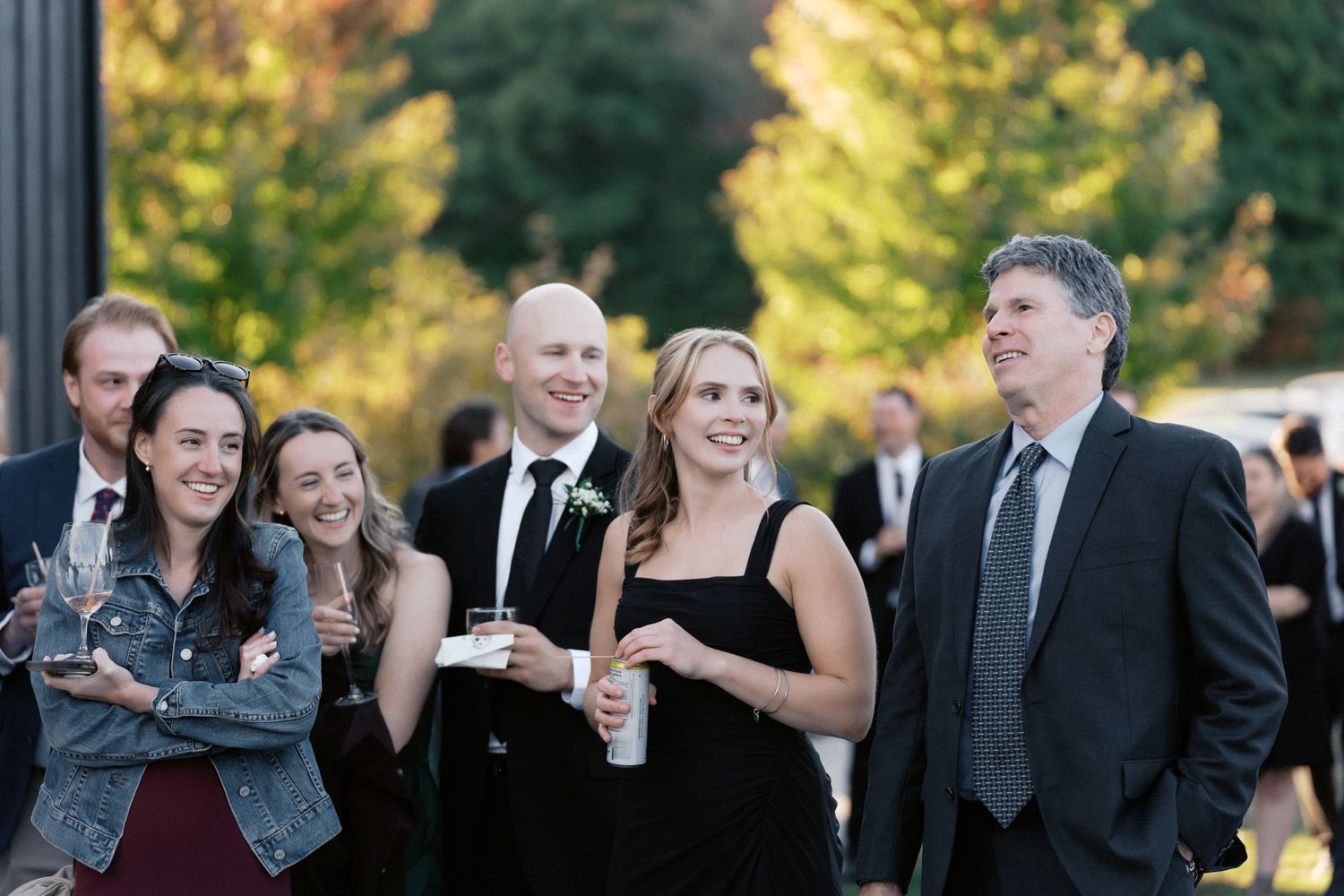 Wedding guests mingling during outdoor cocktail reception.