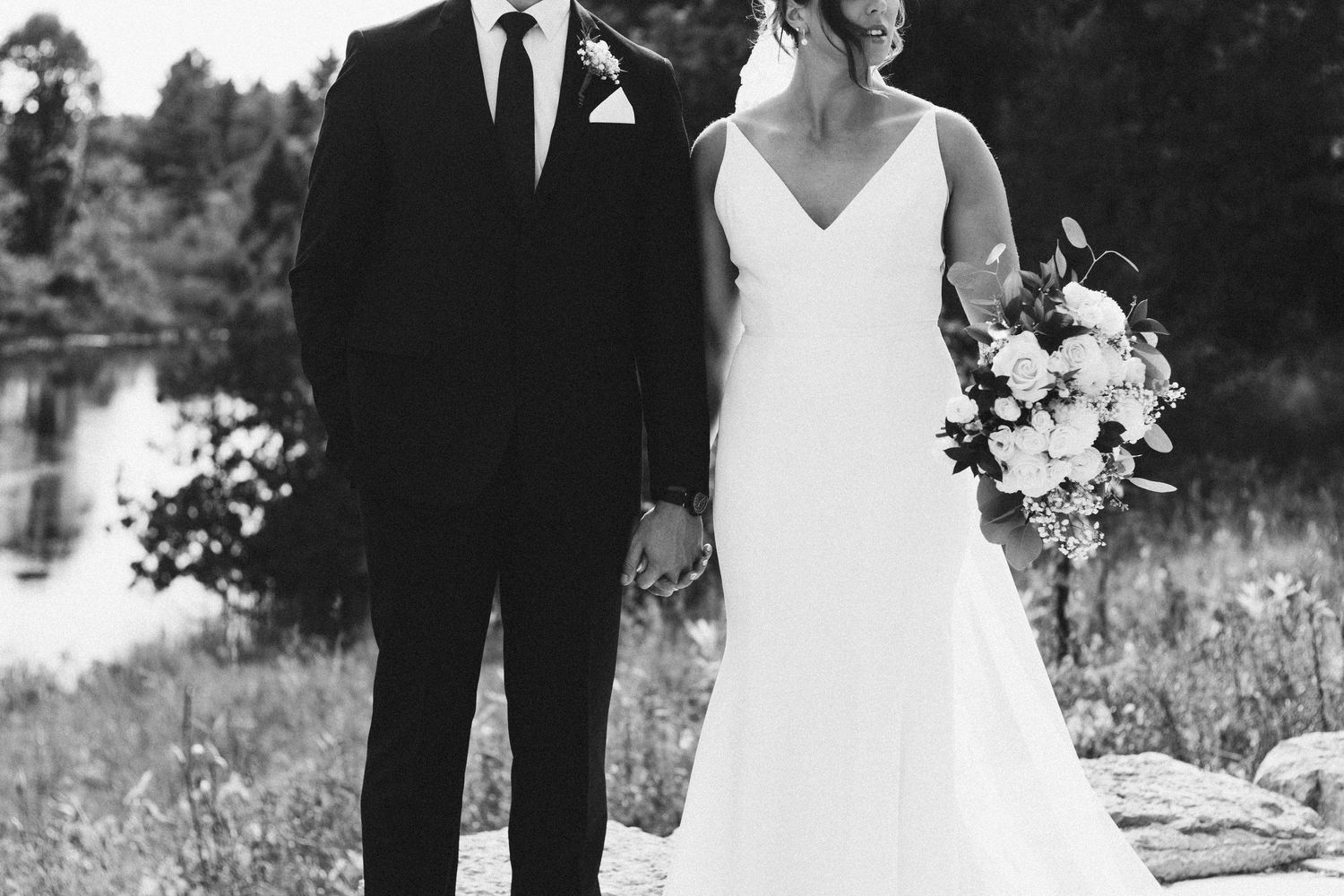 Wedding couple poses in elegant black and white portraits against a natural outdoor backdrop.