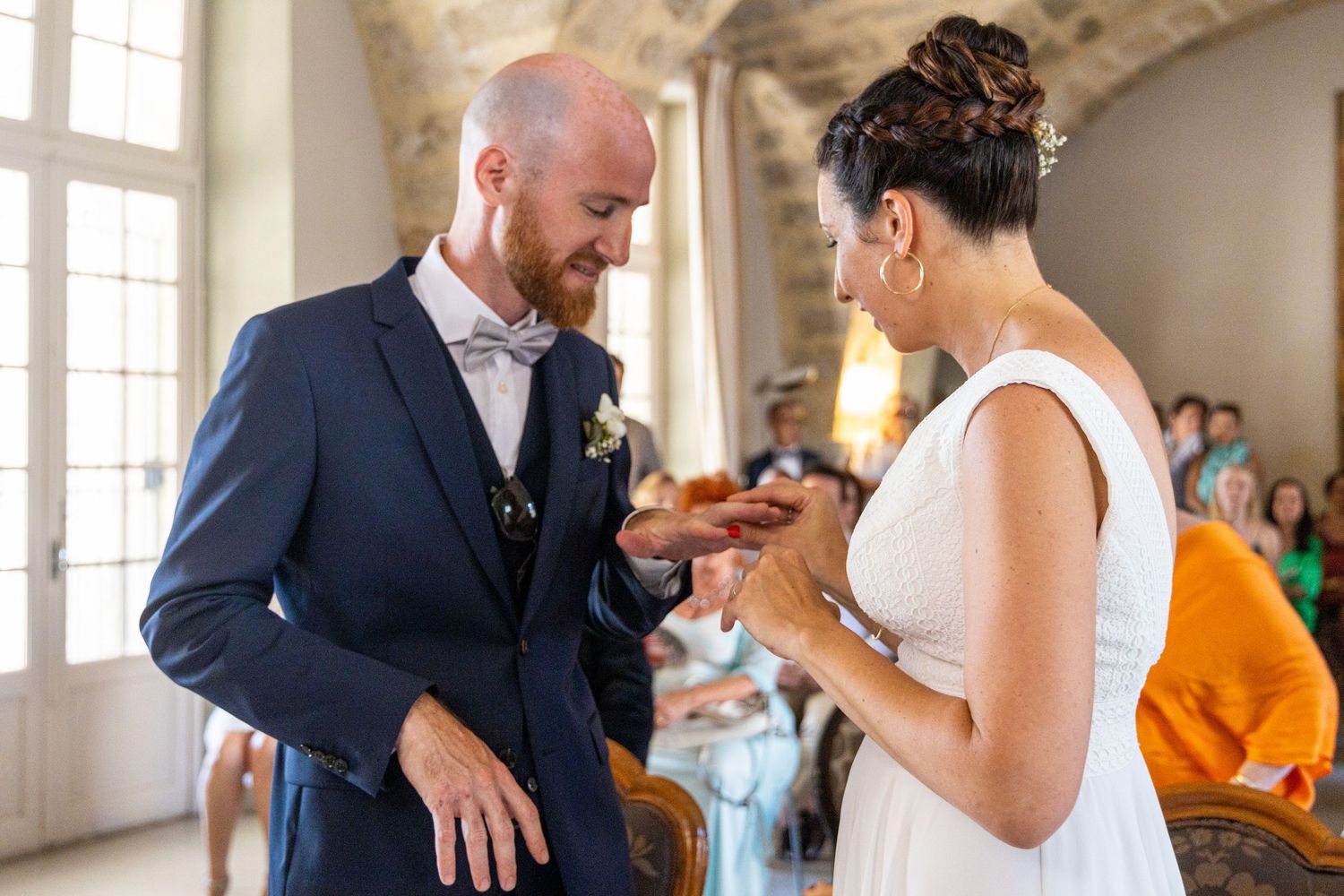Emotional civil ceremony in a historic stone building.