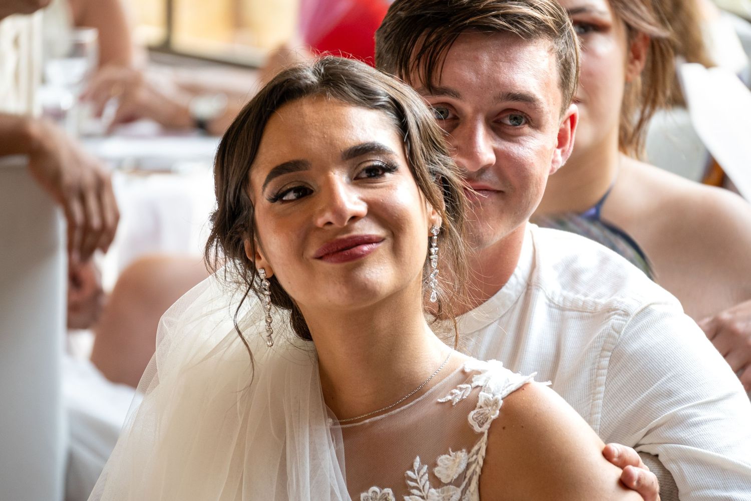 Candid moments captured during an indoor wedding celebration.