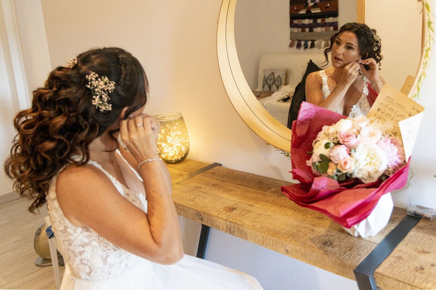 Wedding day preparation moments captured as bride gets hair and makeup done.