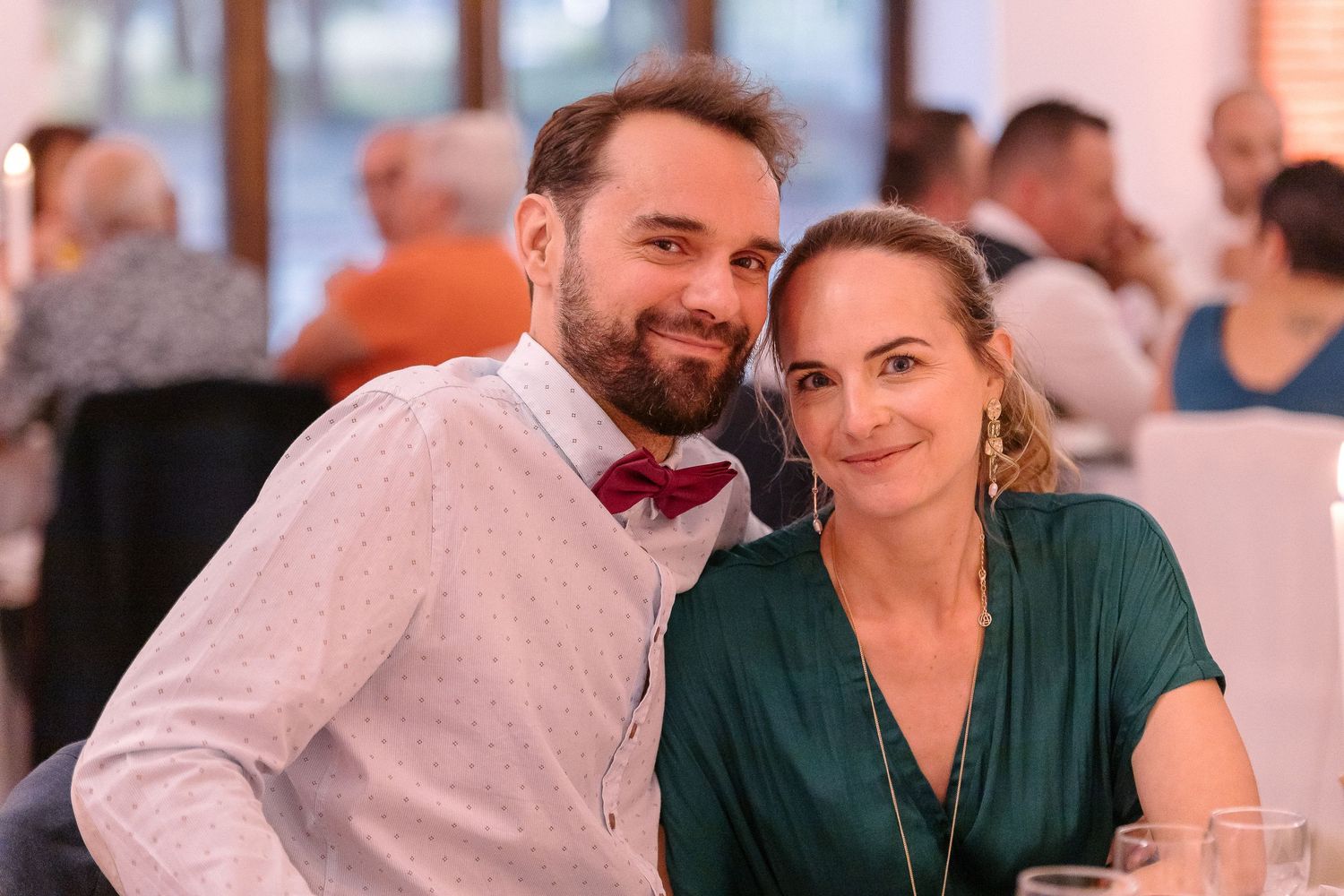 A couple enjoying a romantic dinner at an elegant restaurant.