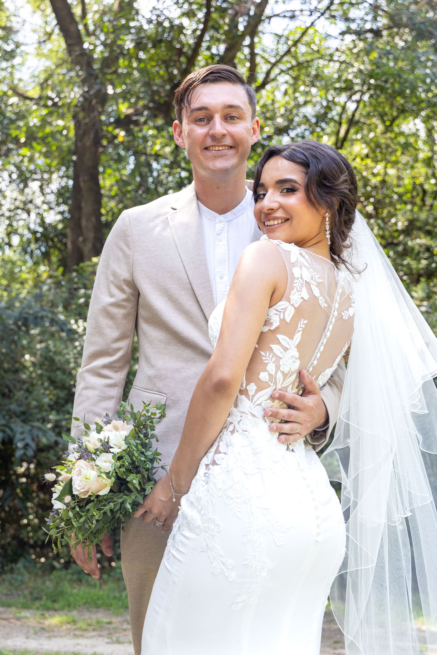 Playful outdoor wedding photography sequence with couple in white attire and flowing veil.